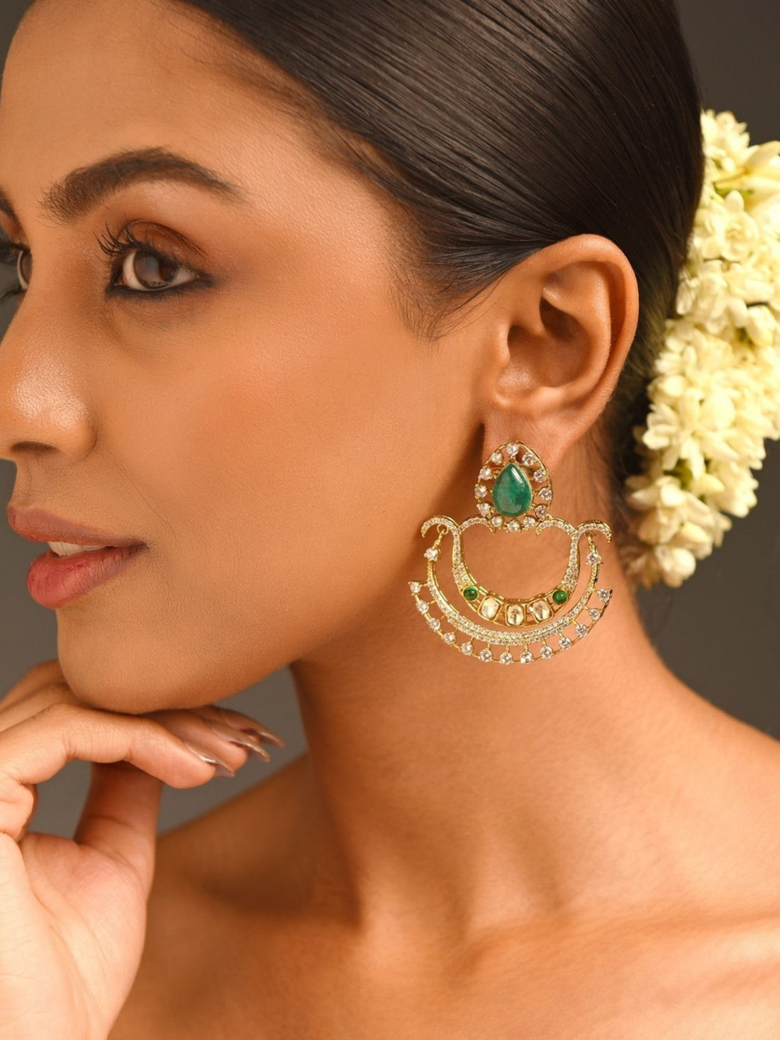Abdesignsjewellery gold chandelier earrings with teardrop green stone and crystals on model green stone earrings for women
