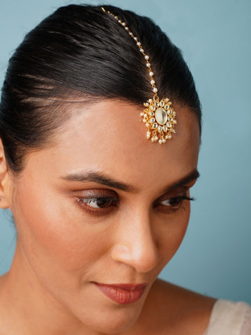 Gold Plated Polki Paachi Kundan Maangtikka worn on forehead by woman with sleek hair