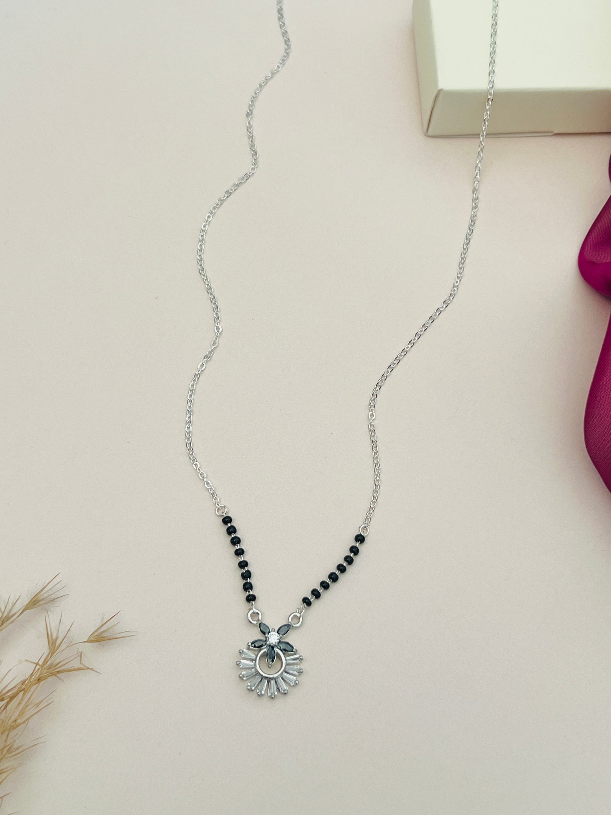 Dazzling American Diamond Mangalsutra with black beads and silver pendant by Abdesignsjewellery