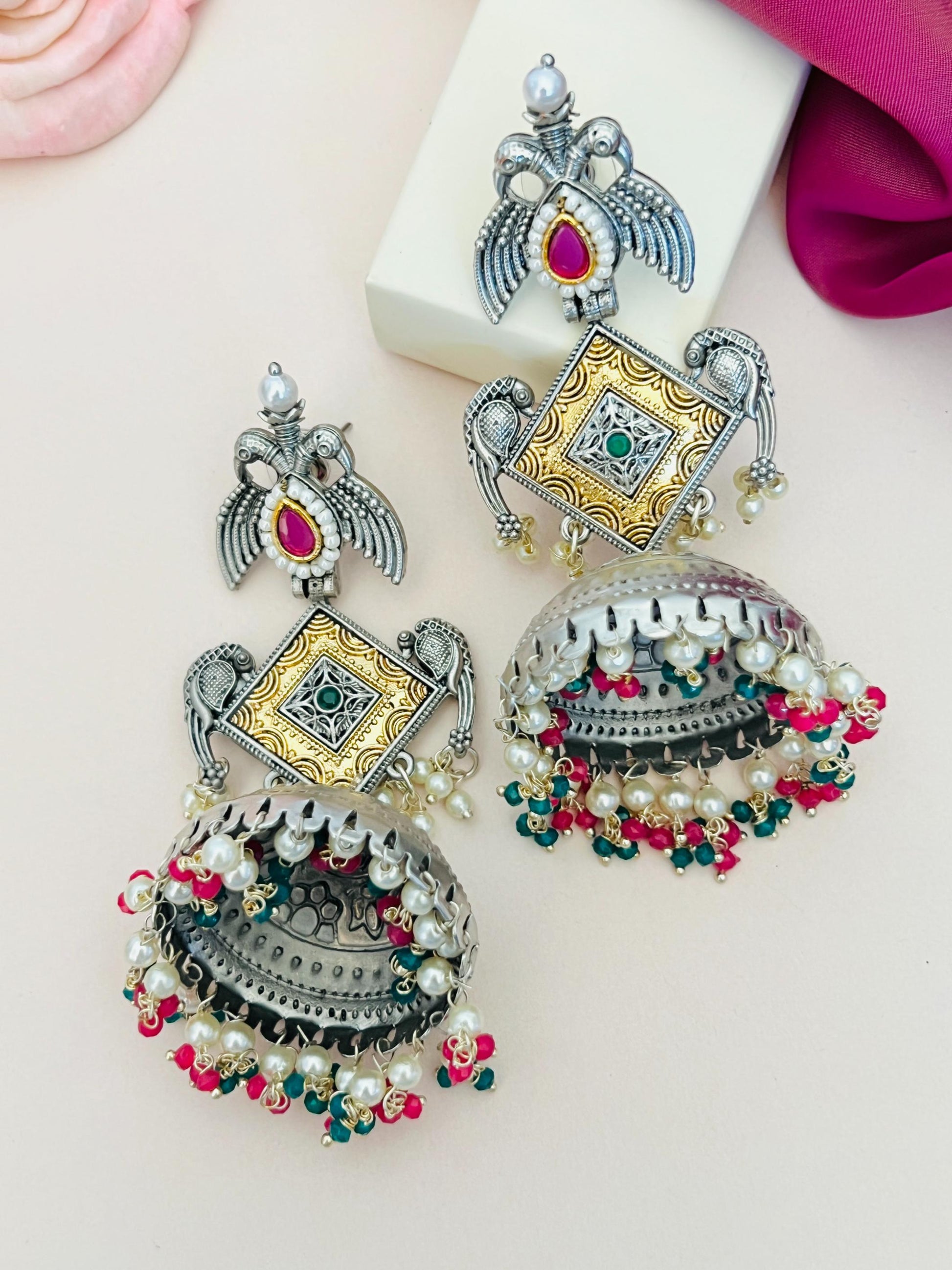Long German Silver Plated Jhumka Earring with intricate gold and silver design adorned with colorful beads