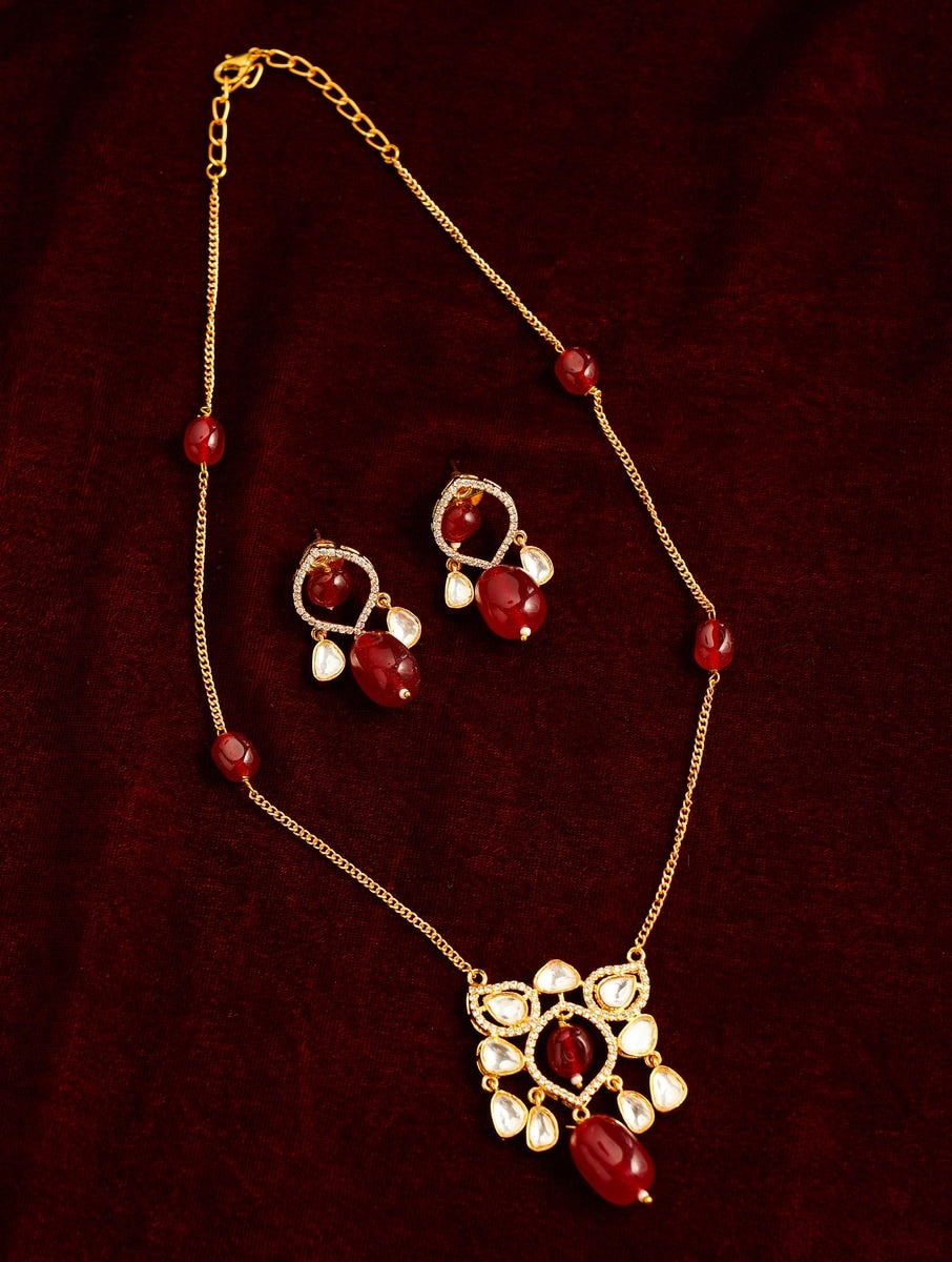 Premium Gold Plated Polki Pendant Set with red gemstones and matching earrings by Abdesignsjewellery