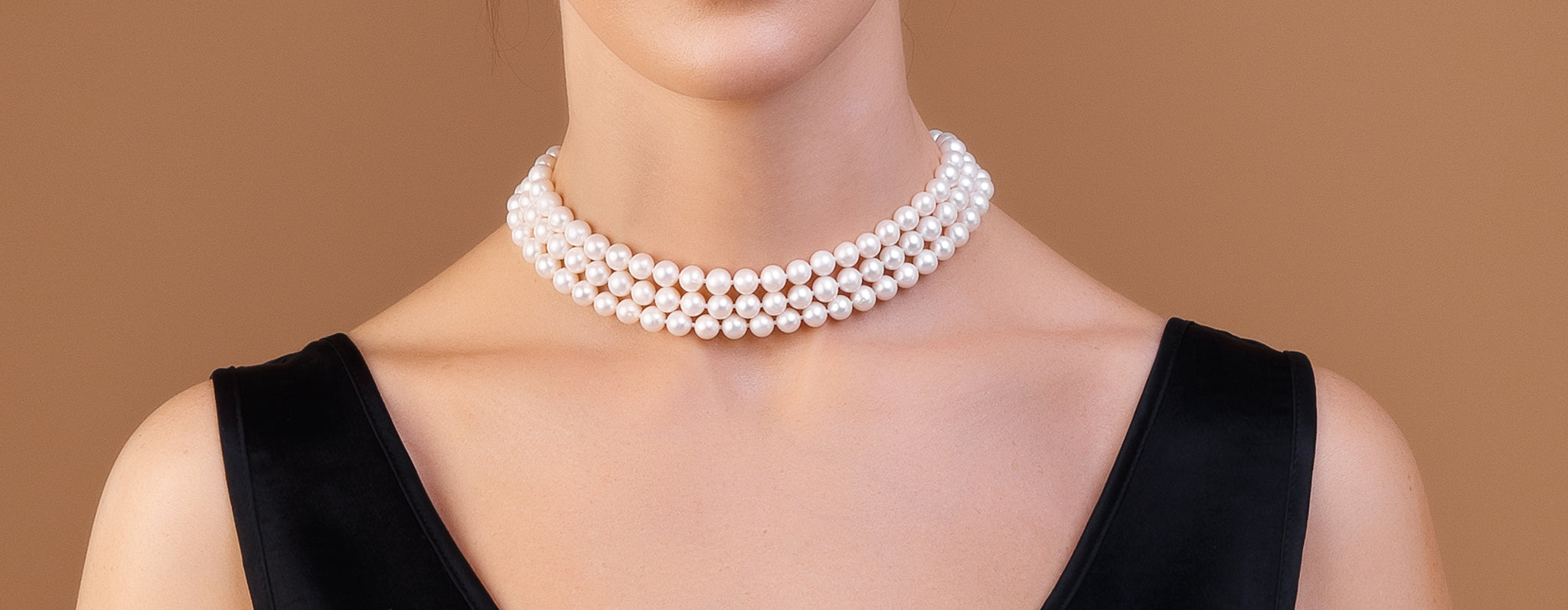 girl wearing pearl necklace