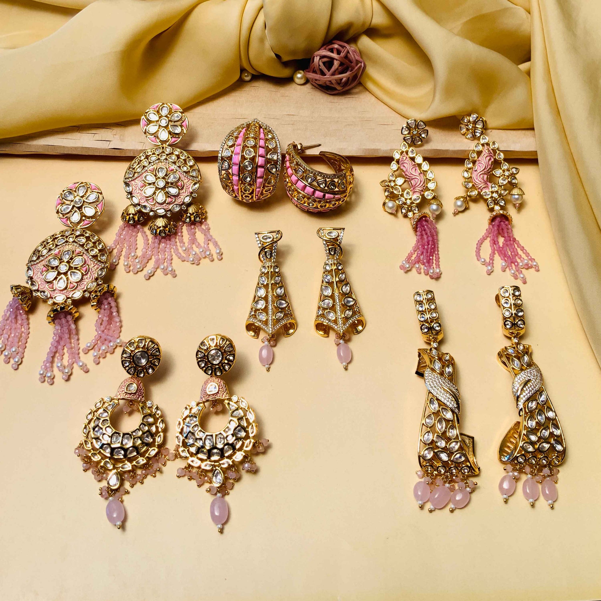 Collection of beautiful Colour Shades earrings including chandelier, hoop, and dangle styles with pink and gold accents