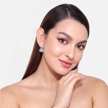 Woman wearing stylish silver Office Wear Earring with geometric design on light background