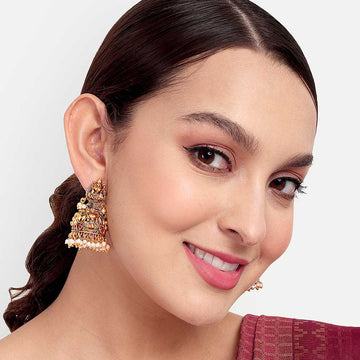 Close-up of a woman wearing traditional gold Temple Earring with intricate design and pearl accents