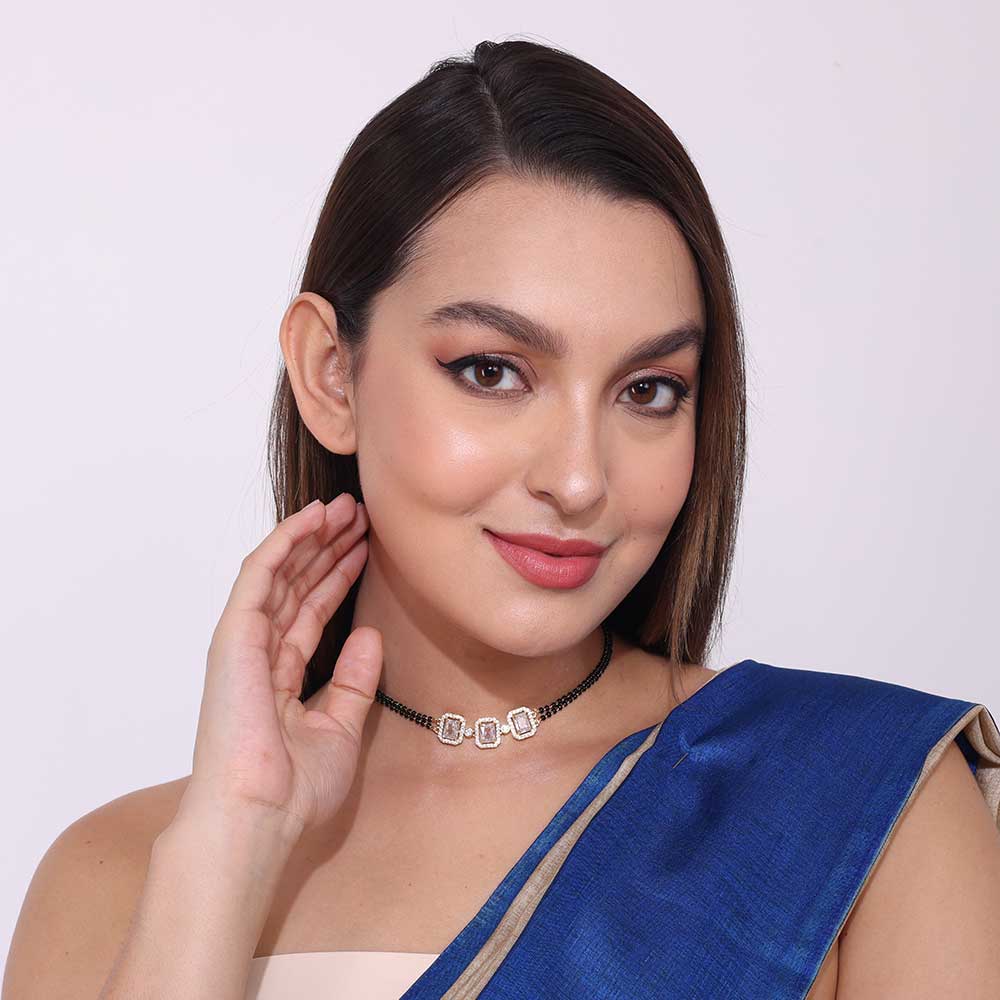 Elegant American Diamond cz Zircon Mangalsutra necklace worn by woman with blue saree showcasing jewelry detail