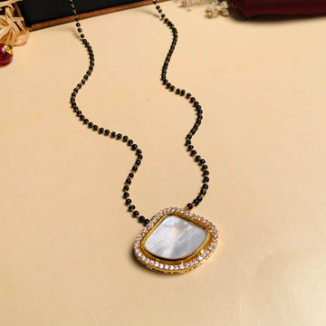 Elegant pearl mangalsutra online featuring a delicate black bead chain with a gold and pearl pendant