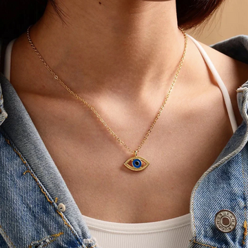 Western Jewellery Evil Eye necklace in gold brass plating worn with casual denim jacket and white top