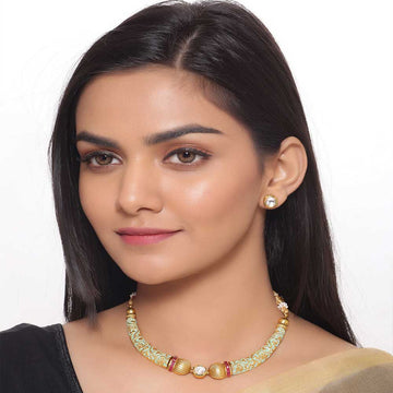 Elegant short necklaces worn by woman with traditional attire showcasing detailed design and craftsmanship