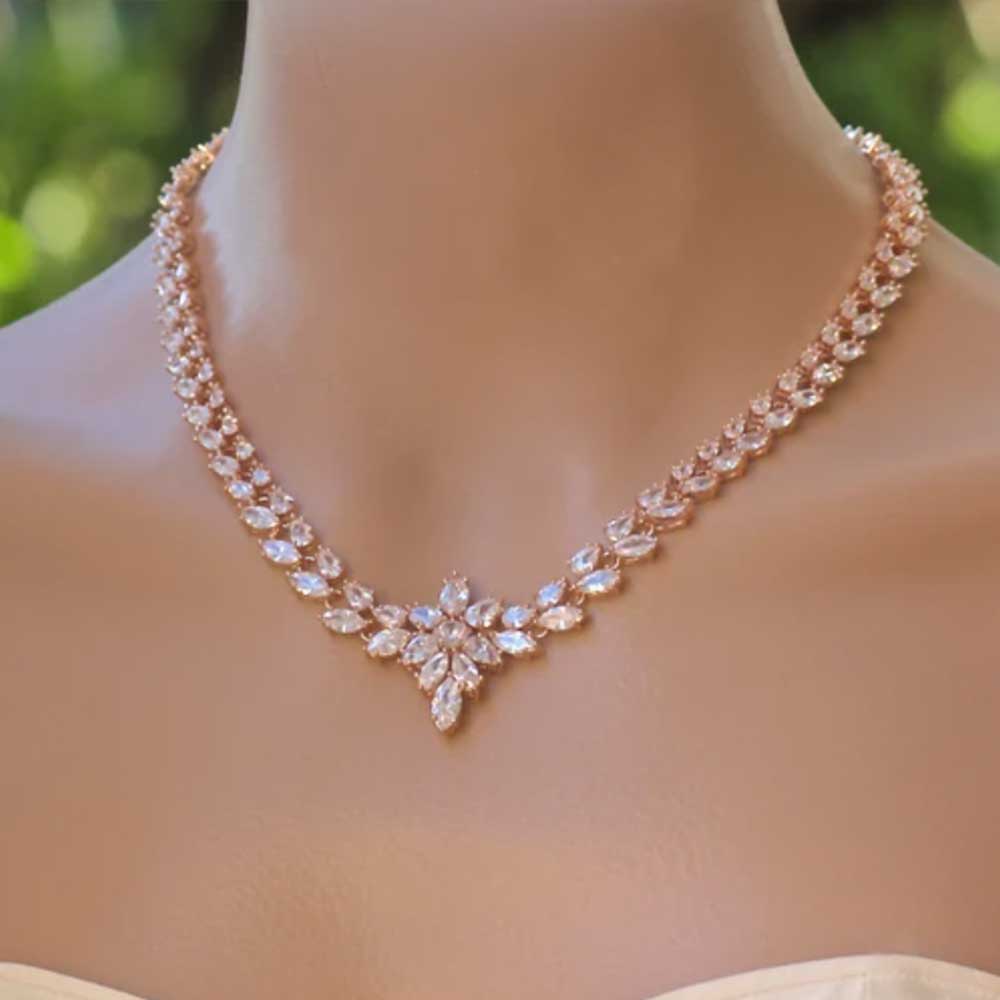 Elegant rose gold necklaces online featuring sparkling gemstones and intricate floral design