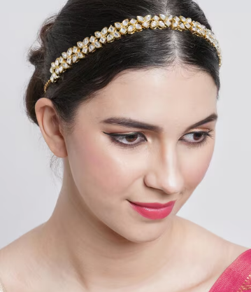 Elegant Sheeshphool Mathapatti headpiece with intricate floral design worn by a woman