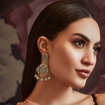 Elegant earrings, featuring intricate designs with gems and drop accents, perfect for special occasions.