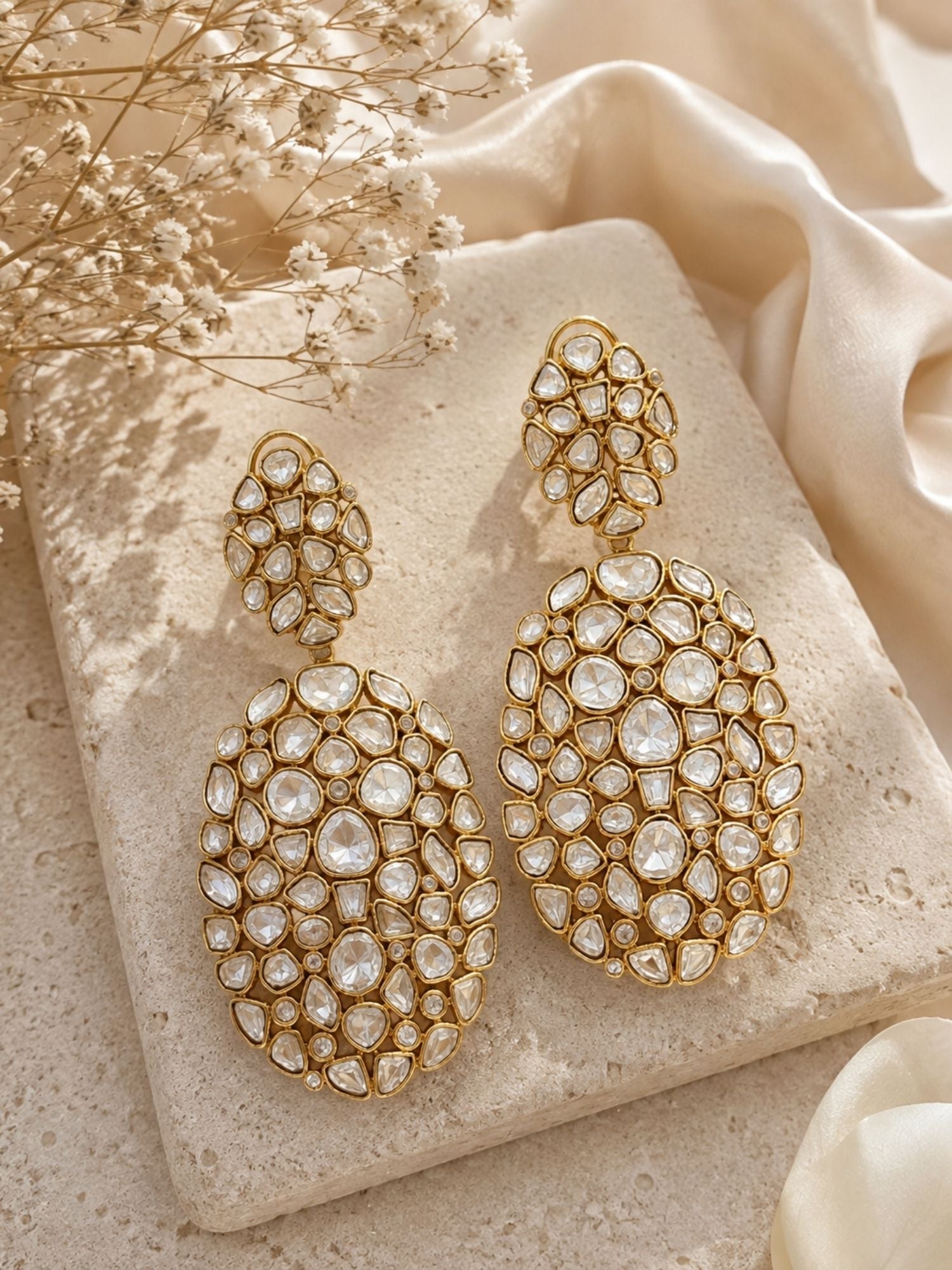 Model wearing Kundan elephant charm drop earrings, festive look