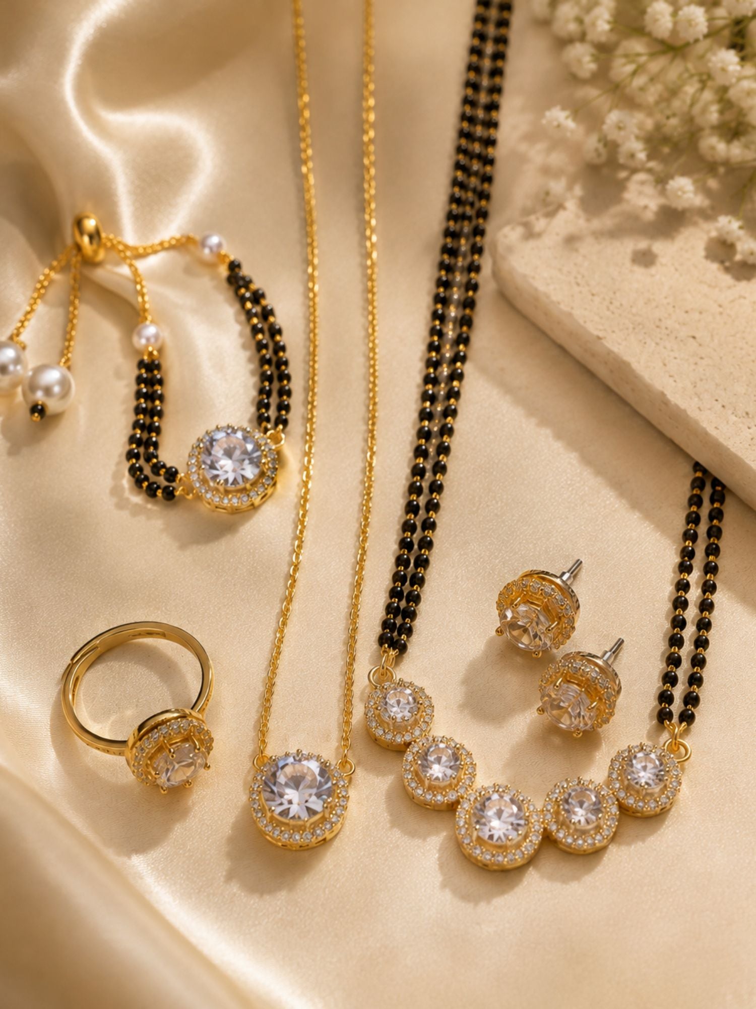 Close up of American Diamond solitaire pendant on gold plated black beaded mangalsutra set