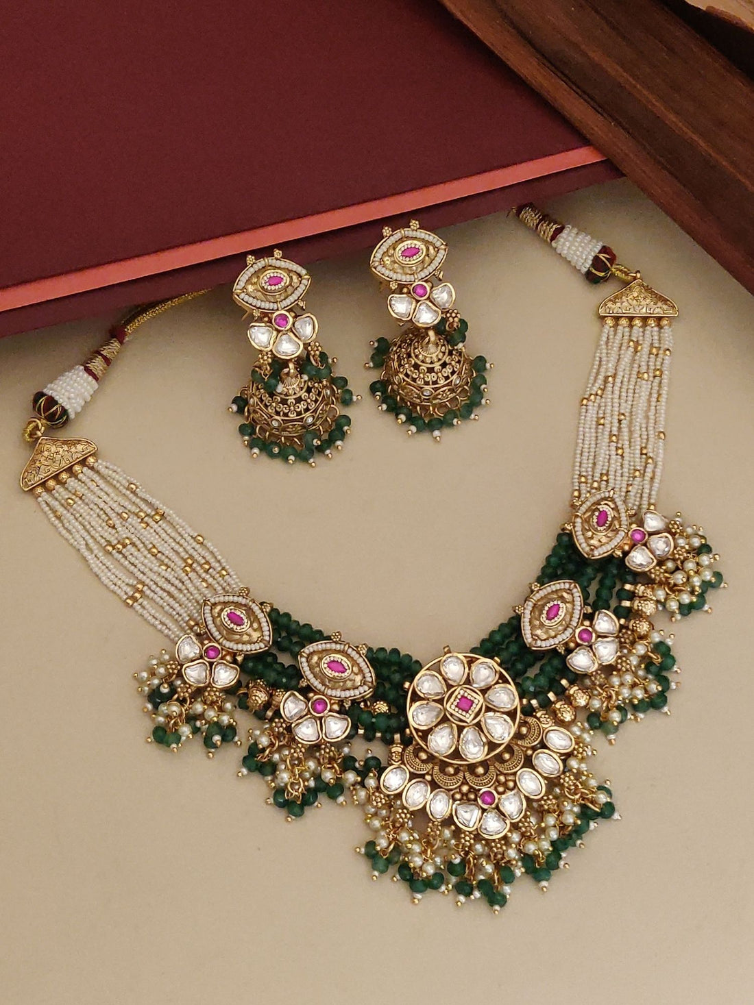 Elegant gold plated necklace with intricate designs and matching earrings for a stunning look