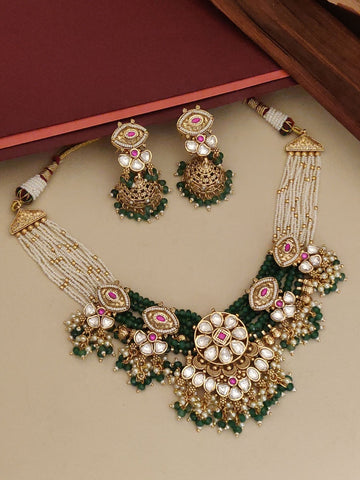 Elegant gold plated necklace with intricate designs and matching earrings for a stunning look
