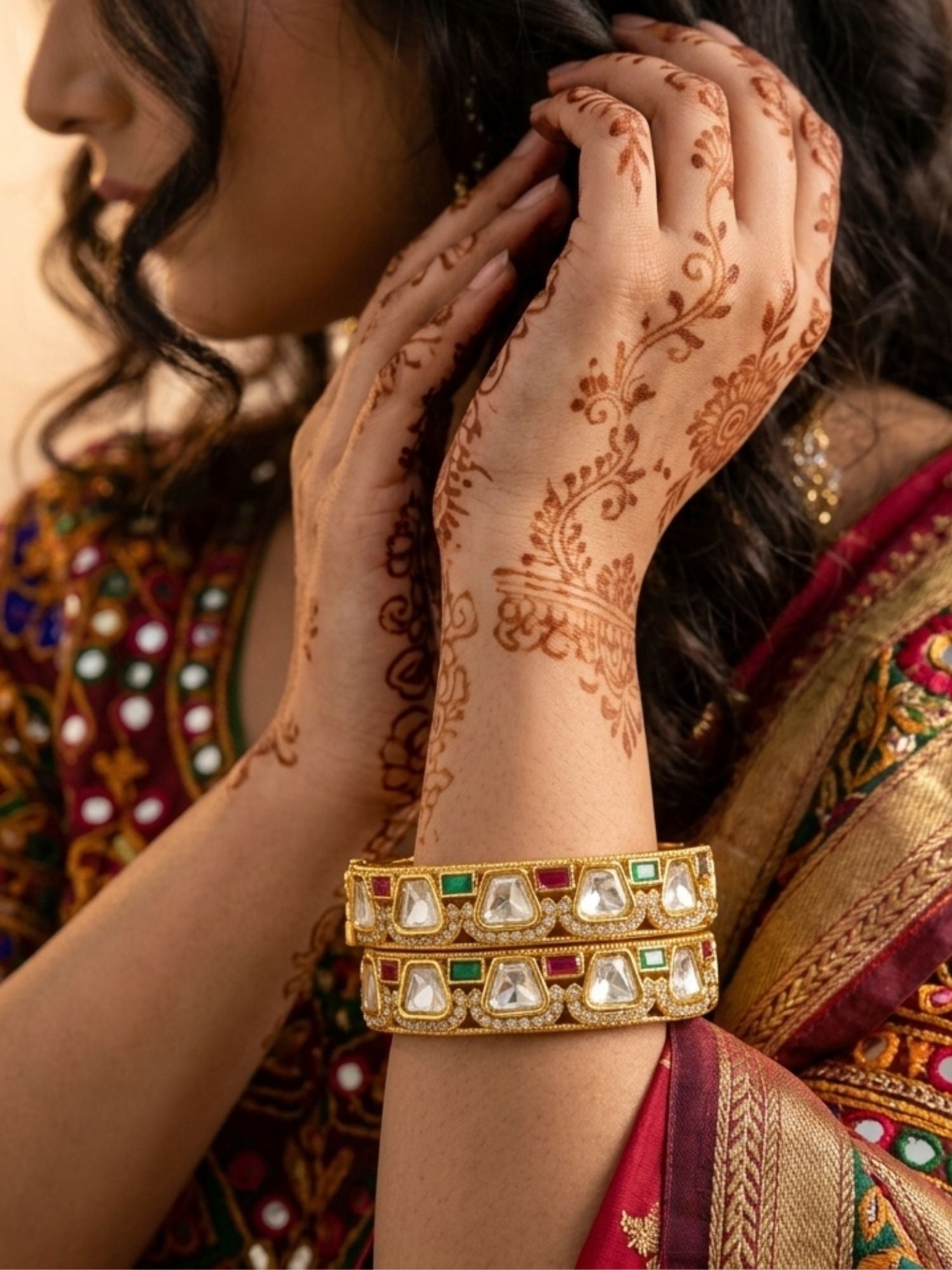 Woman wearing Abdesigns gold plated multicolour polki moissanite bangles styled with traditional Indian outfit