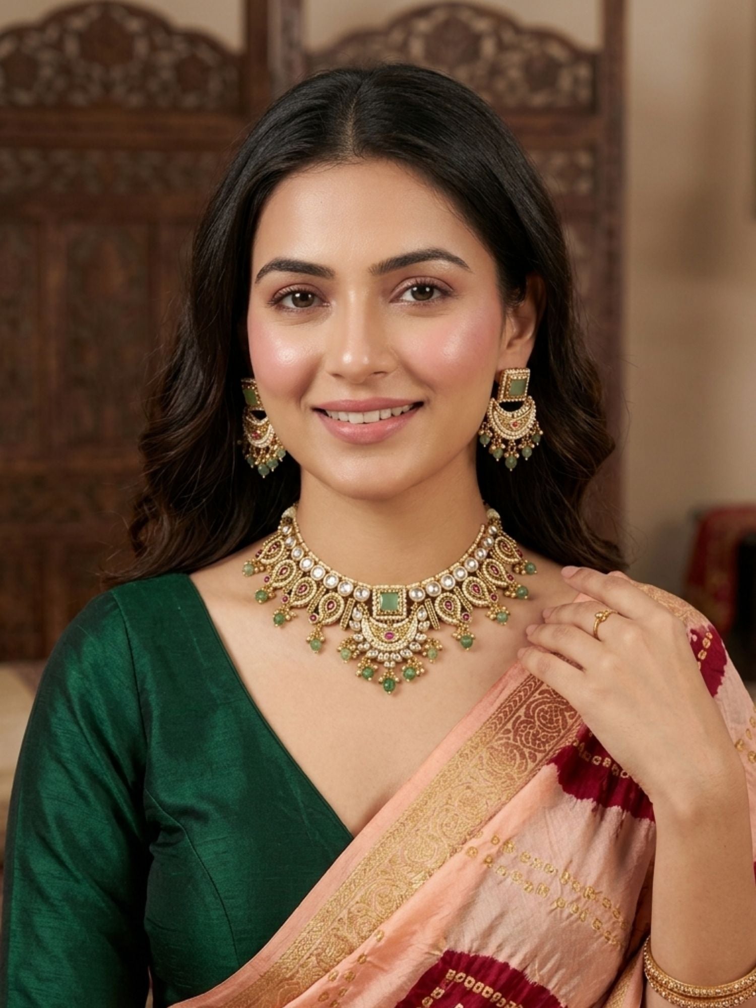 Woman wearing Abdesigns semi bridal gold short necklace set styled with elegant traditional Indian outfit