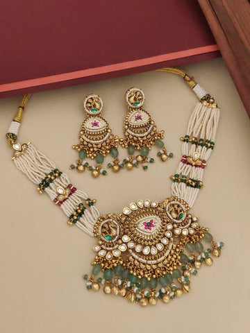 gold plated Ahmedabadi choker necklace set with multi strand pearls green bead drops and matching jhumka earrings