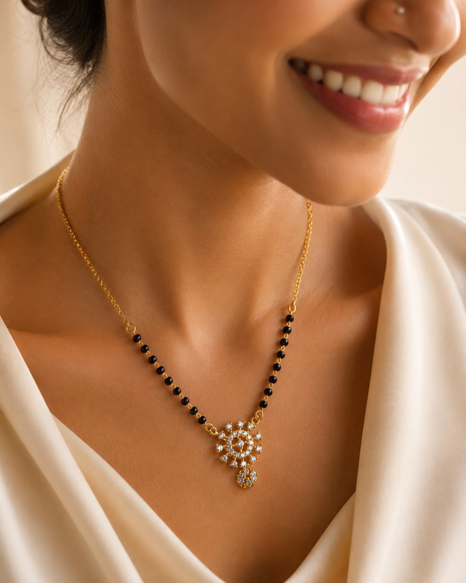 Modern minimalist mangalsutra close-up — CZ pendant, gold plated brass chain