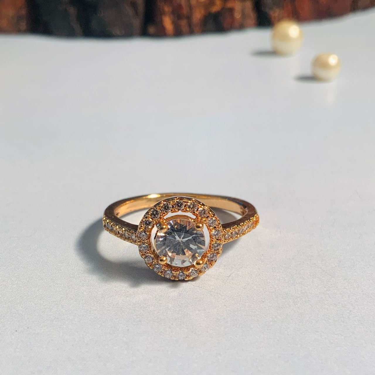 AI generated Beautiful platinum rings with a rose gold accent is shown up  close, positioned on a white surface with gentle sunlight softly  highlighting the rings details in the background. 36333814 Stock