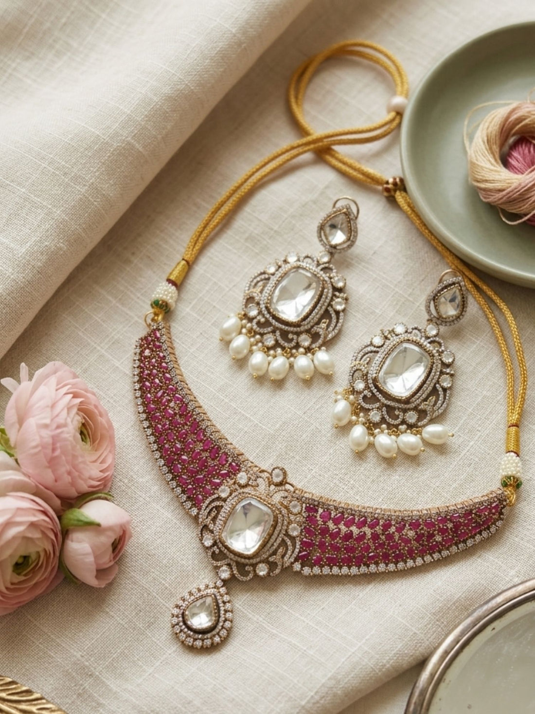 Woman wearing Abdesigns Victorian style polki ruby emerald necklace set styled with luxurious traditional Indian outfit