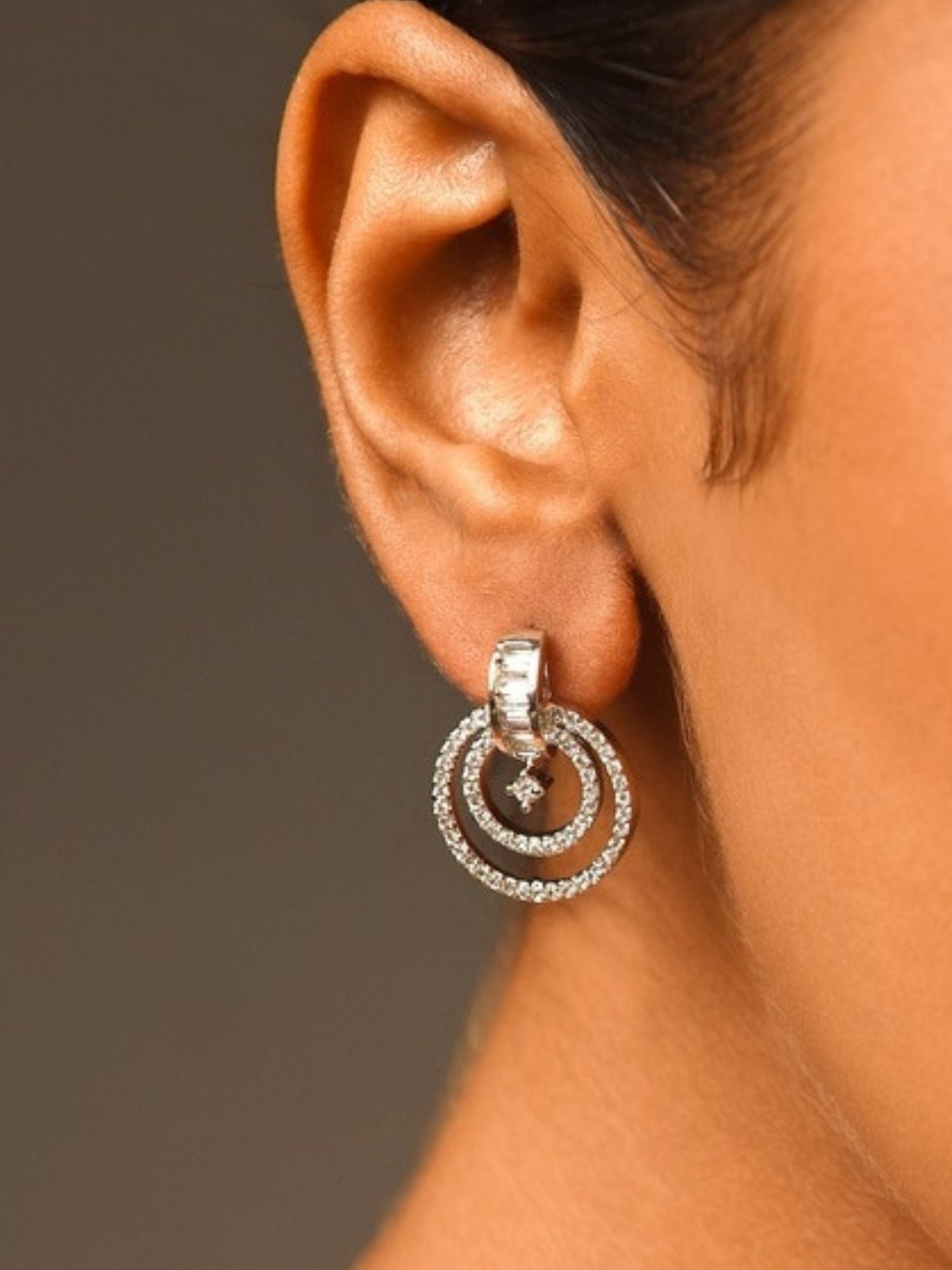 Stunning Silver Plated American Diamond Earring with double hoop design worn on a ear