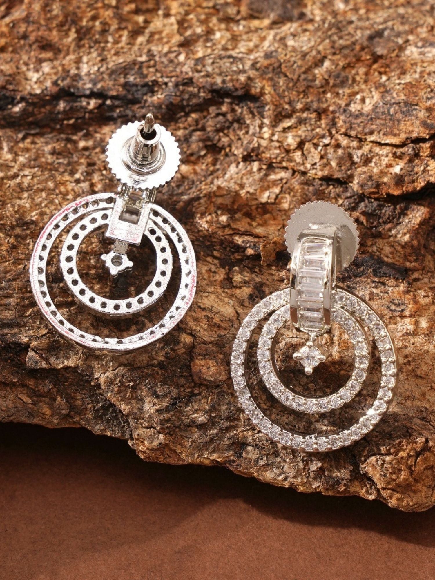 Stunning Silver Plated American Diamond Earring with double hoop design by Abdesignsjewellery on textured brown background