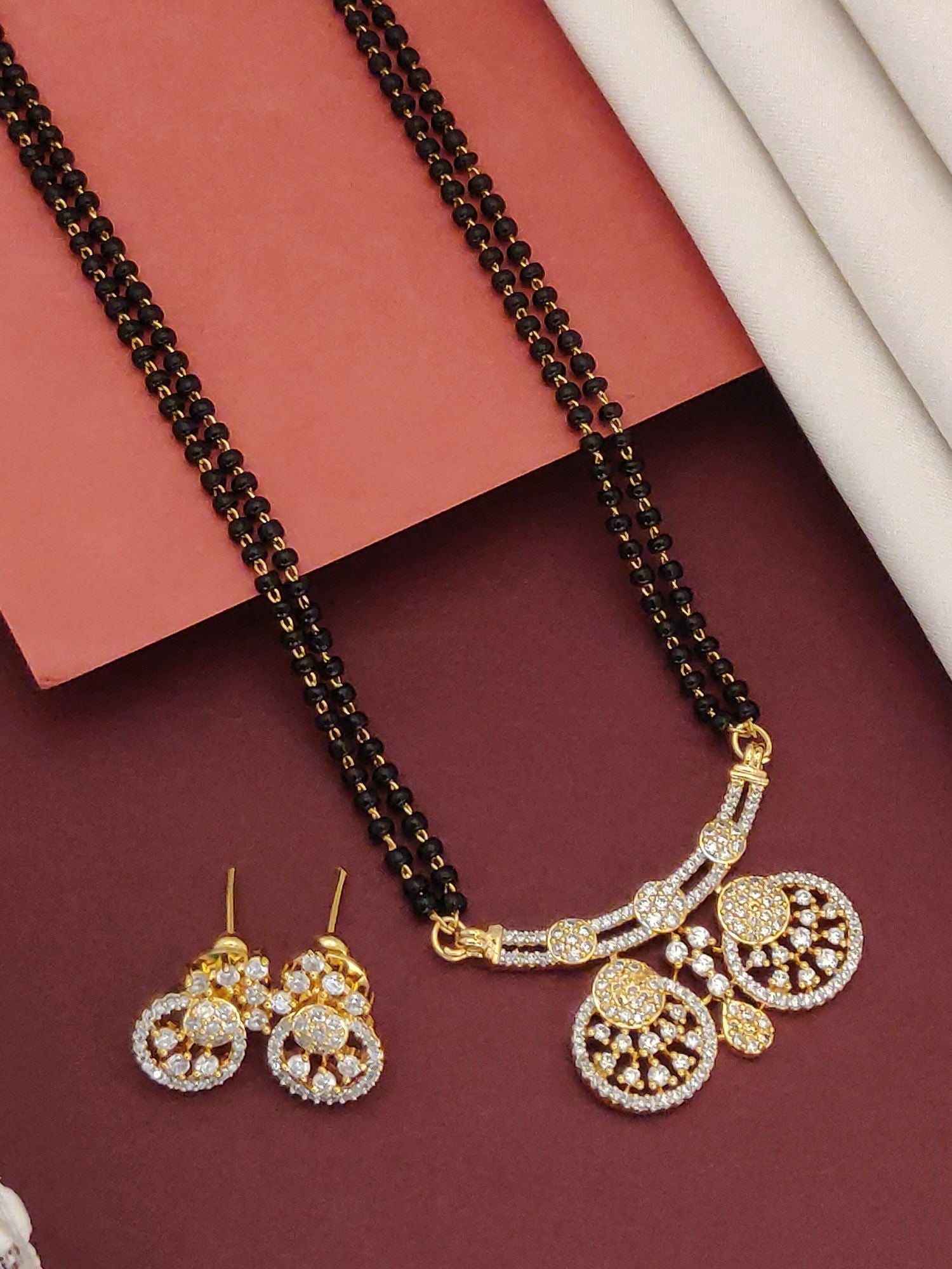 Abdesigns Black Beads CZ Pendant Mangalsutra With Earrings gold tone triple strand black beads pendant and matching CZ earrings