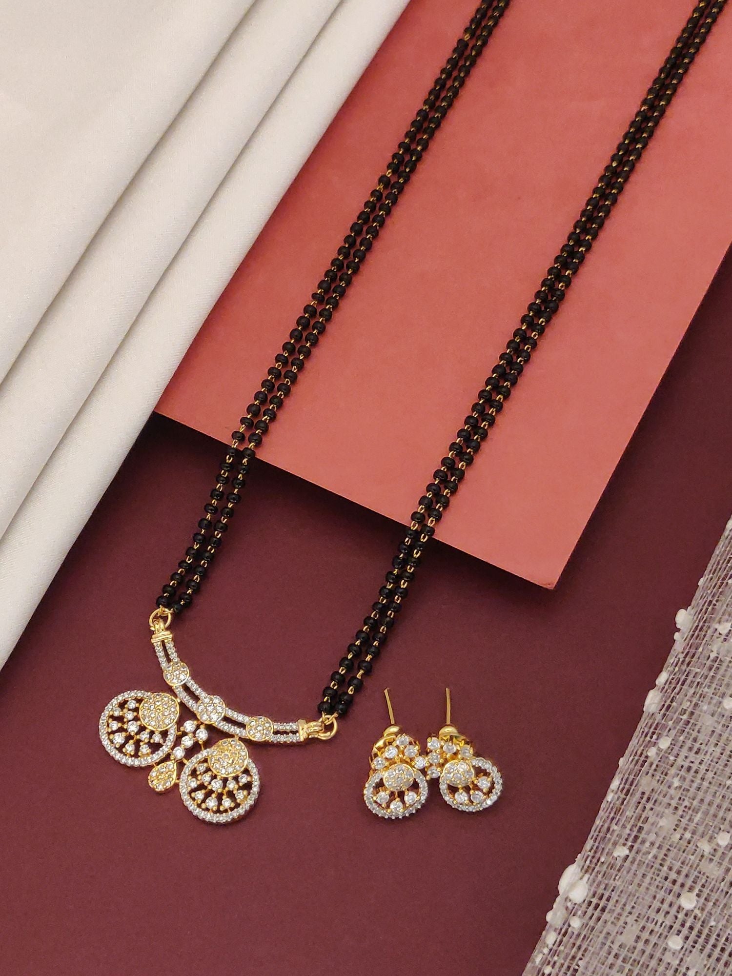 Abdesigns Black Beads CZ Pendant Mangalsutra With Earrings gold pendant and matching earrings on double black beaded chain