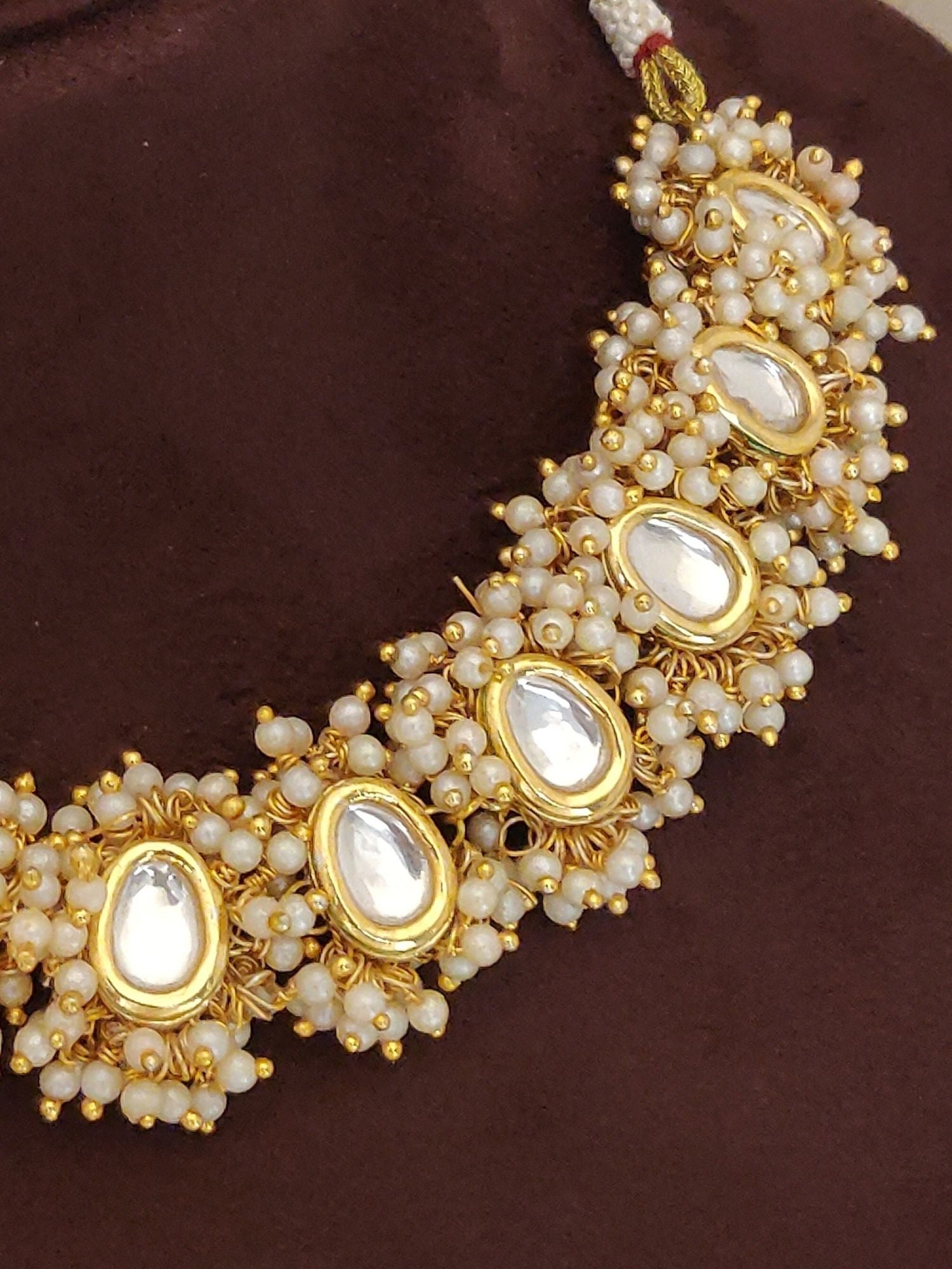Abdesigns Bridal White Kundan Pearl Choker Set necklace featuring gold bezel teardrop kundan stones and clustered ivory pearls