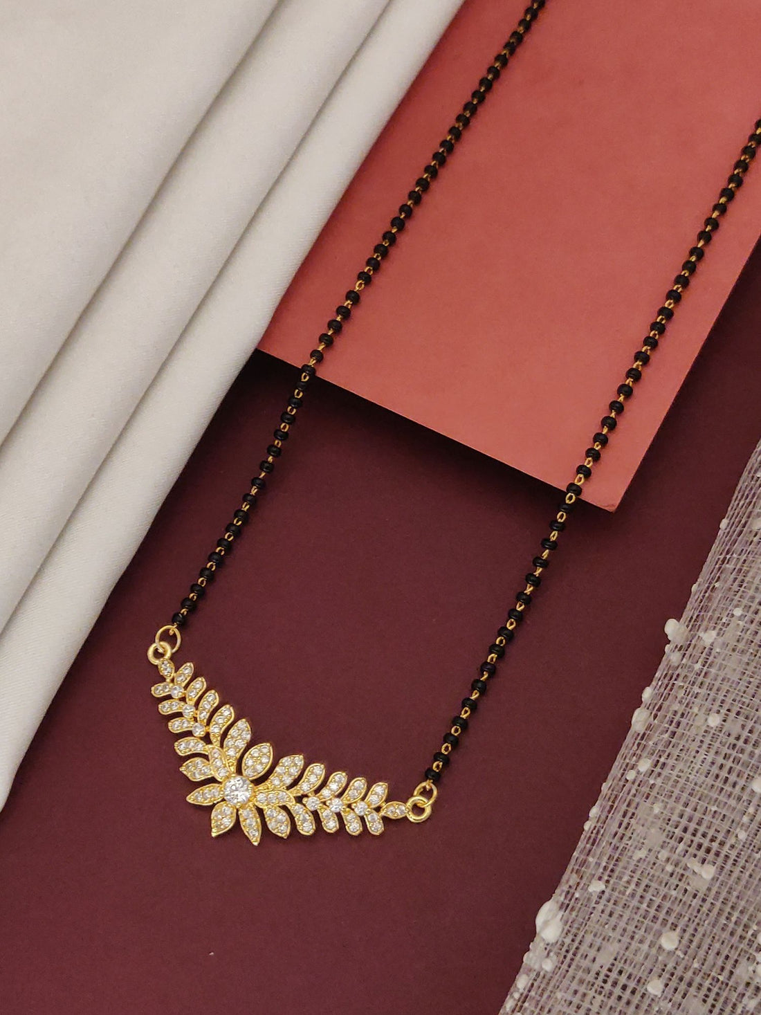 Abdesigns Gold Leaf CZ Mangalsutra black bead chain with gold leaf cubic zirconia pendant for brides