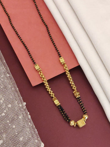 Abdesigns Gold-Plated Black Beads Mangalsutra featuring gold plated pendant and double strand black beads for bridal wear