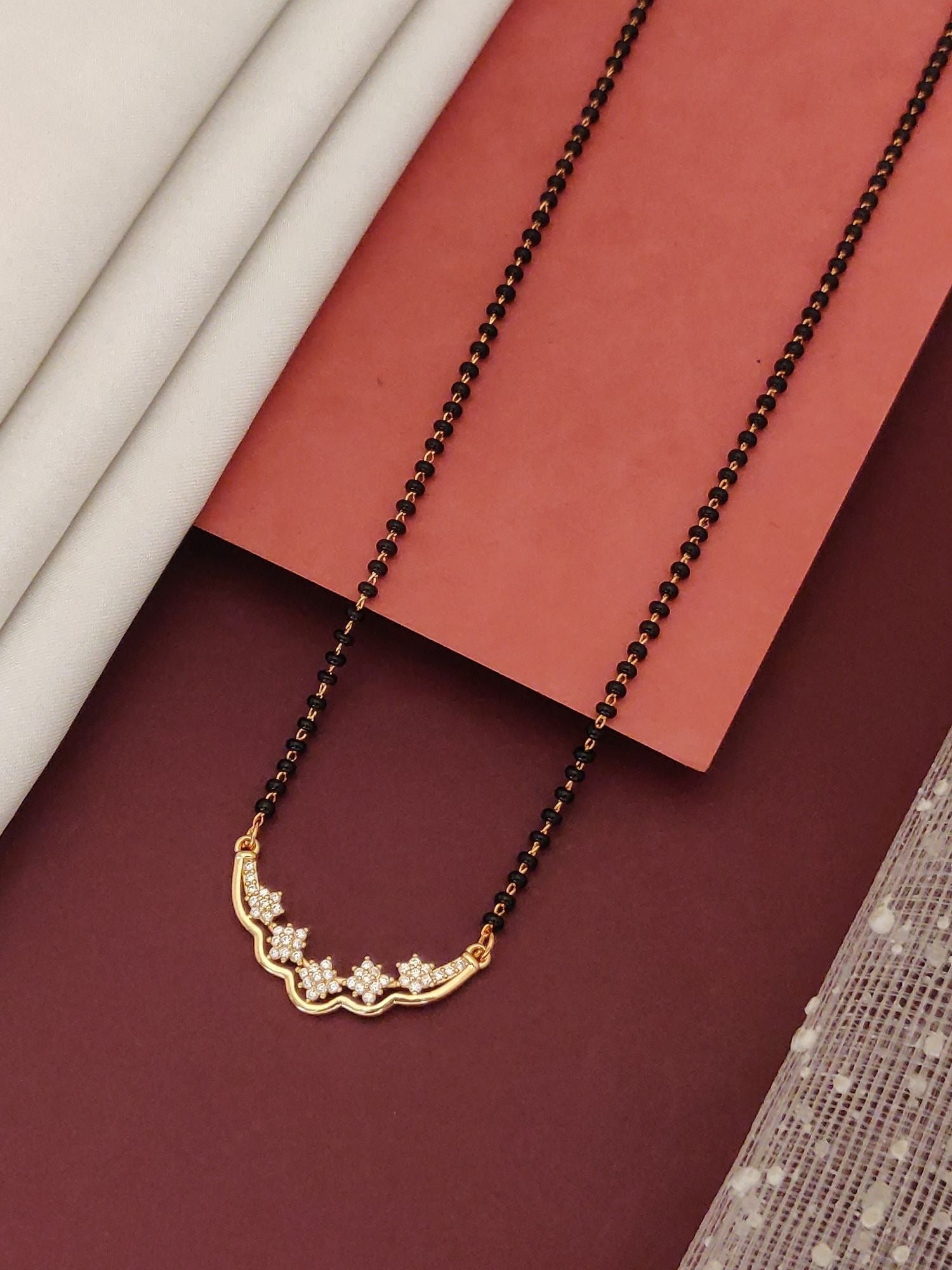 Abdesigns Gold-Plated Mangalsutra Black Beads delicate gold plated pendant with floral CZ stones on black bead chain