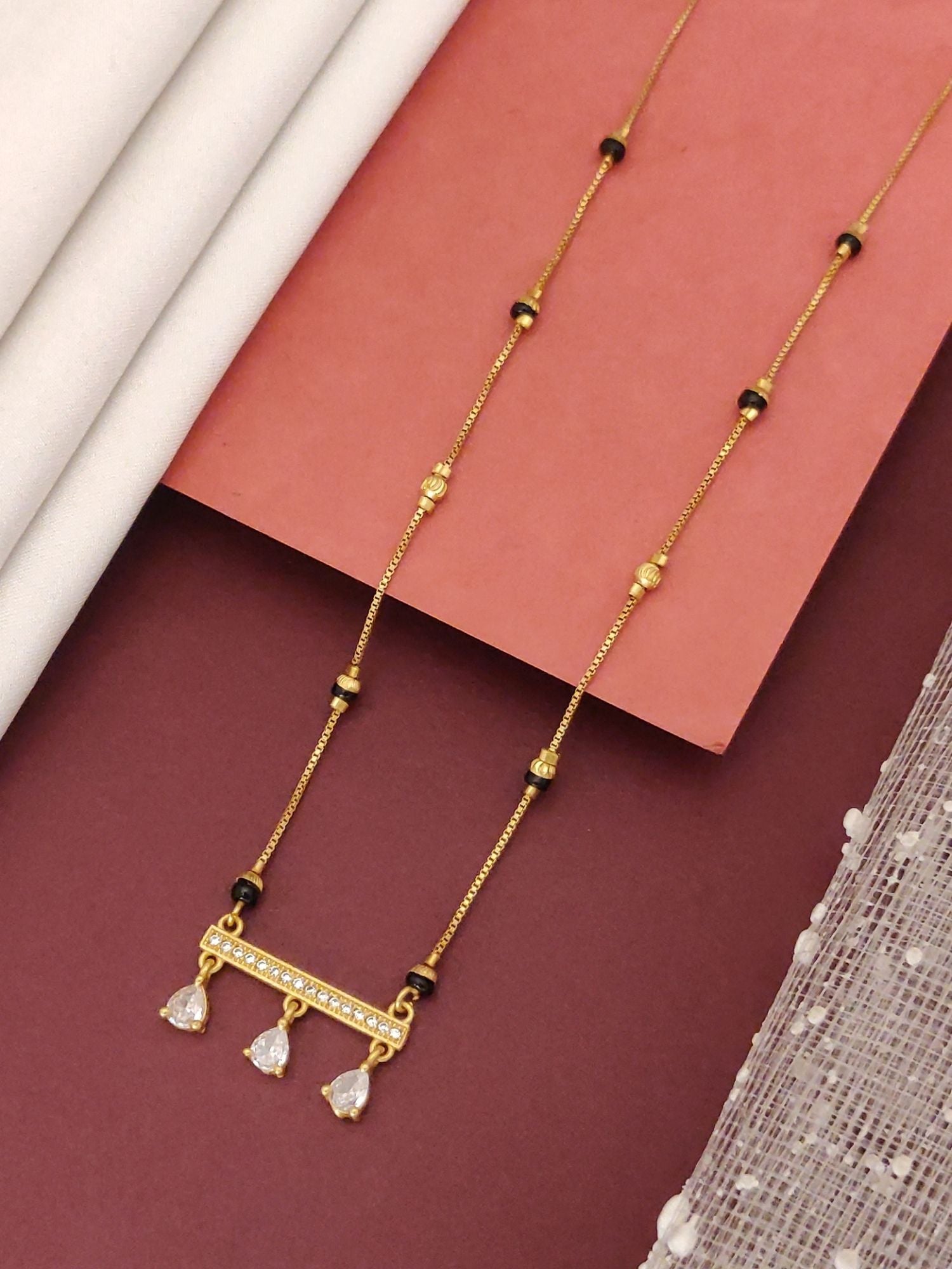 Abdesigns Gold-Plated Mangalsutra with CZ Drops elegant gold chain with black beads and three cubic zirconia teardrop drops