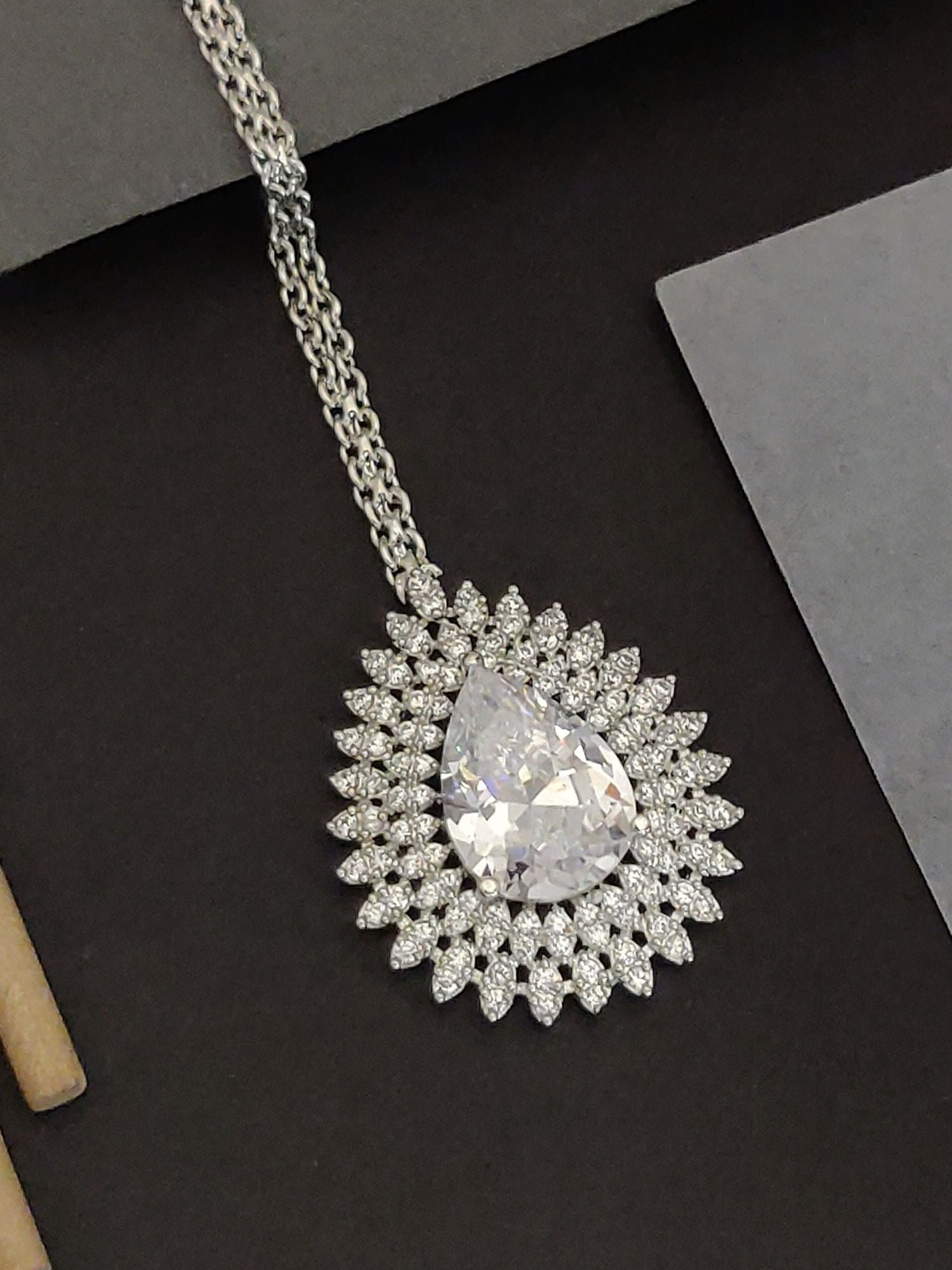 Abdesigns Gold Teardrop CZ Maangtikka. Bridal. Elegant teardrop CZ pendant maangtikka with halo stones on silver chain