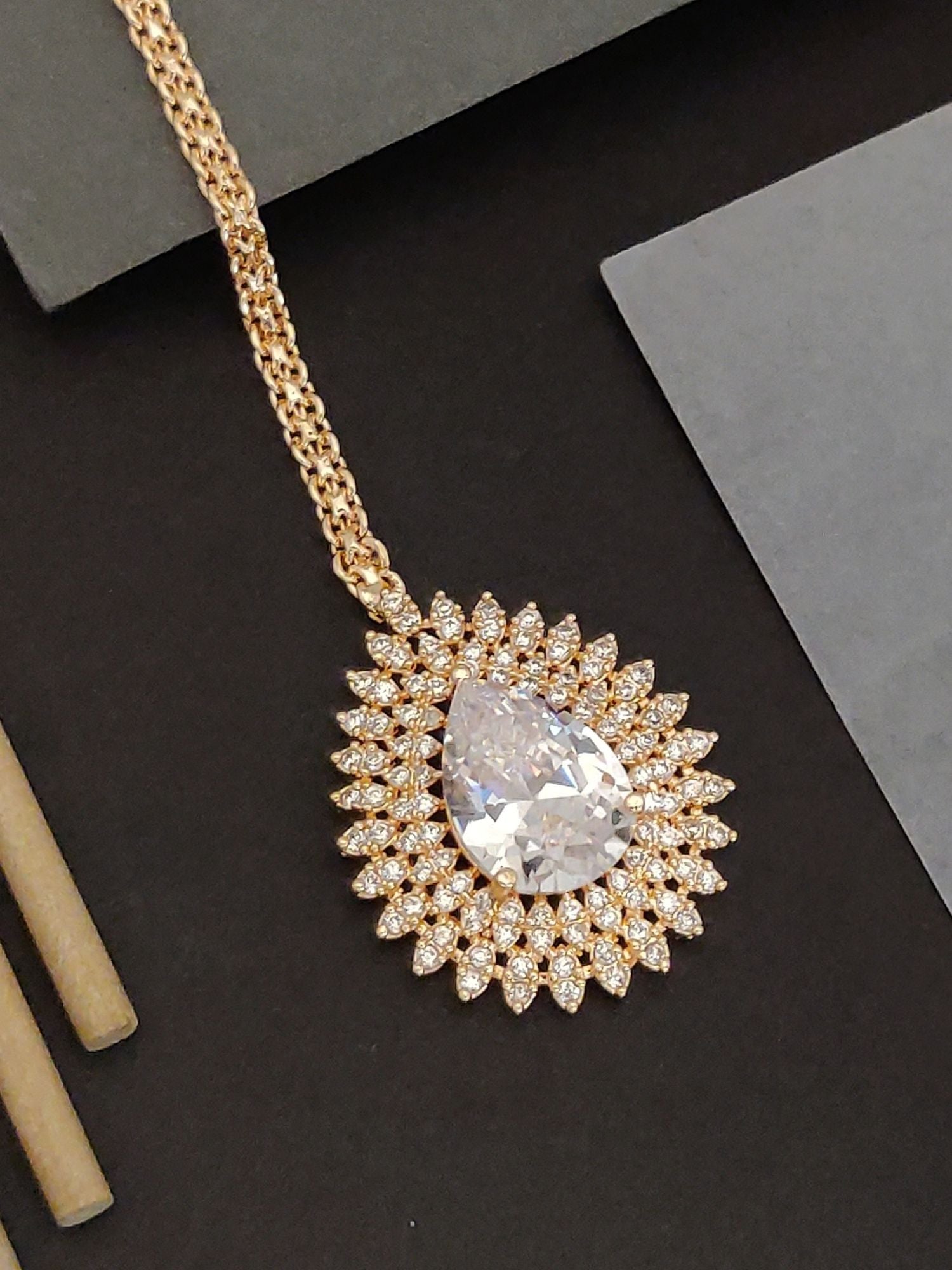 Abdesigns Gold Teardrop CZ Maangtikka. Bridal. Gold maangtikka with large teardrop CZ center stone and halo of pave stones