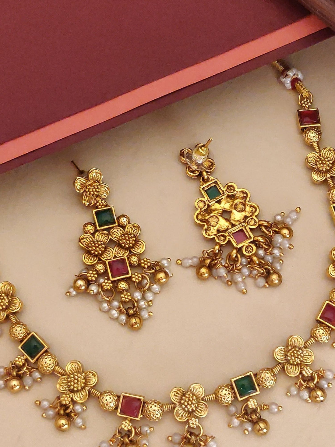 Abdesigns Jewellery Elegant Pendents Chain with Floral Design. Gold necklace red and green stones pearl drops with floral earrings