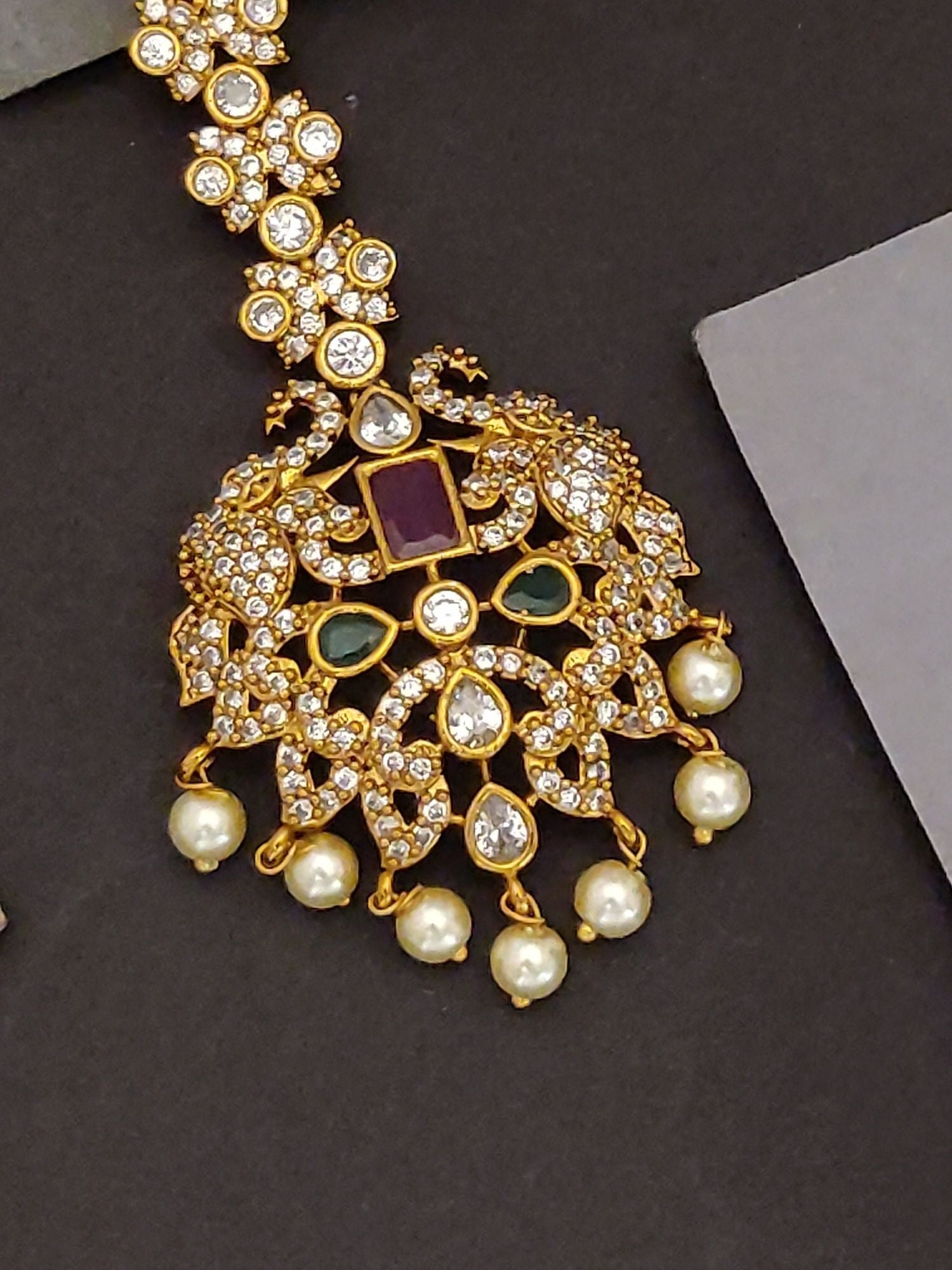 Abdesigns Jewellery Gold Kundan Maangtikka with Pearls.. Traditional gold maangtikka with kundan, green stones and dangling pearls