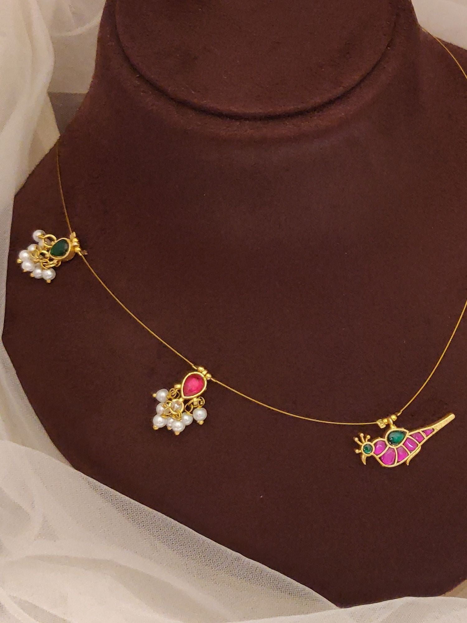 Thin gold chain with three small charms including parrot and pearl cluster Abdesigns Jewellery Pendant Chain with Colorful Stones.