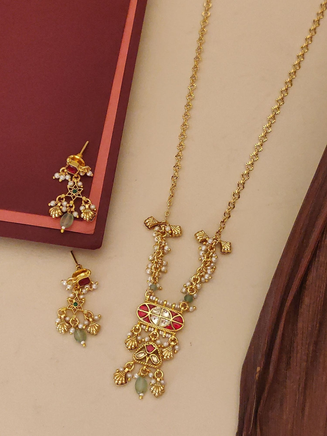 Abdesigns Jewellery Pendents with Pearl and Red Stone Design. Gold plated necklace and earrings with pearls and red stones