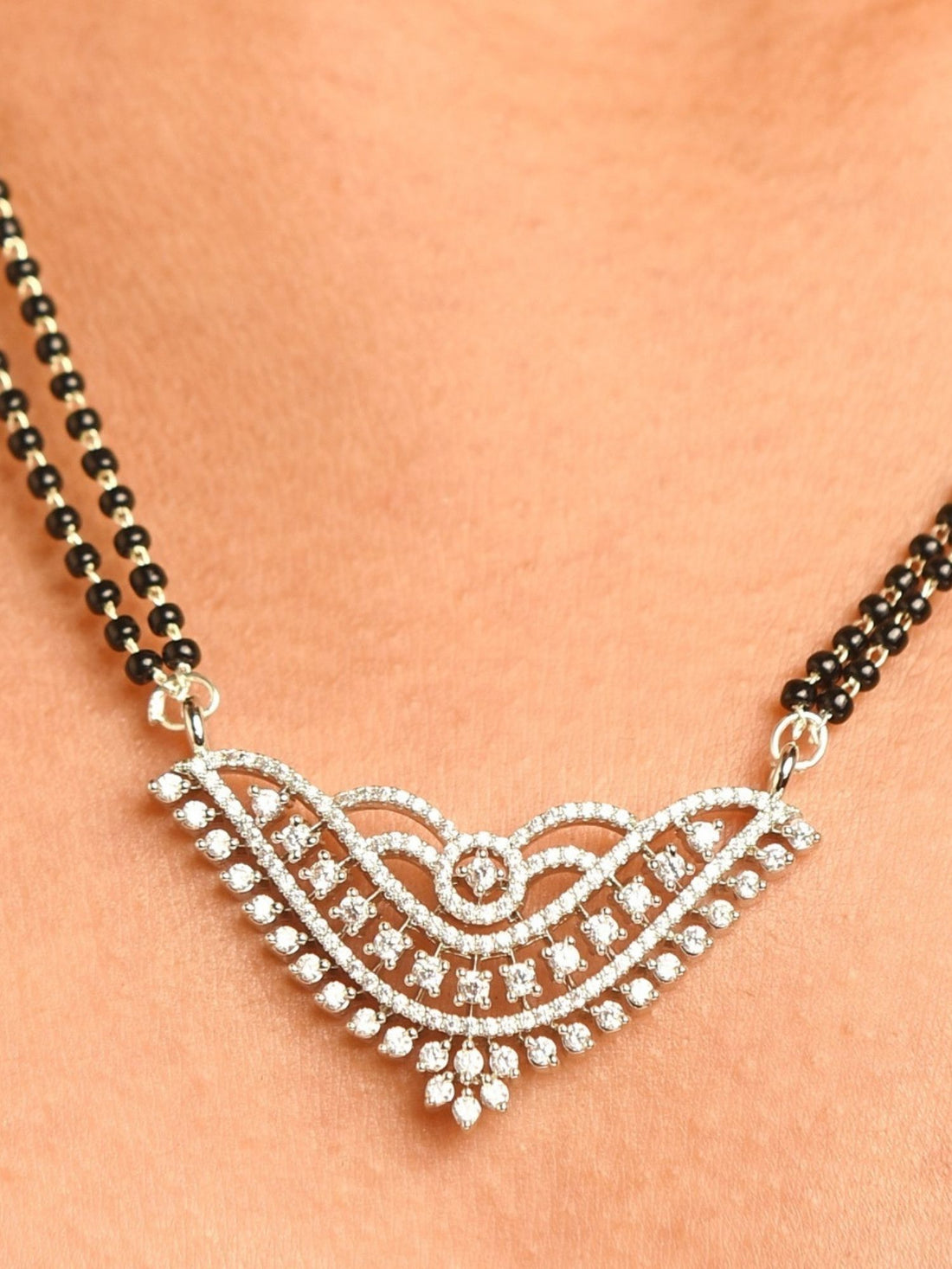 Model wearing Abdesigns Jewellery Silver Plated American Diamond Mangalsutra With Earrings on double black bead chain