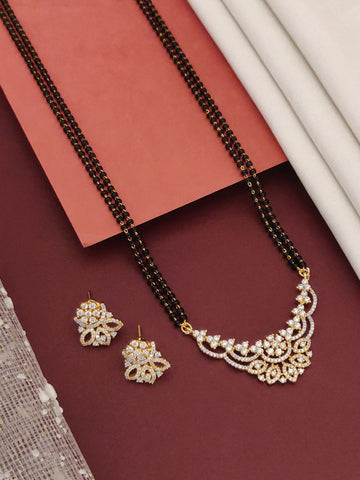 Abdesigns Opulent gold plated mangalsutra for women. Double black bead chain with floral white stone pendant plus earrings