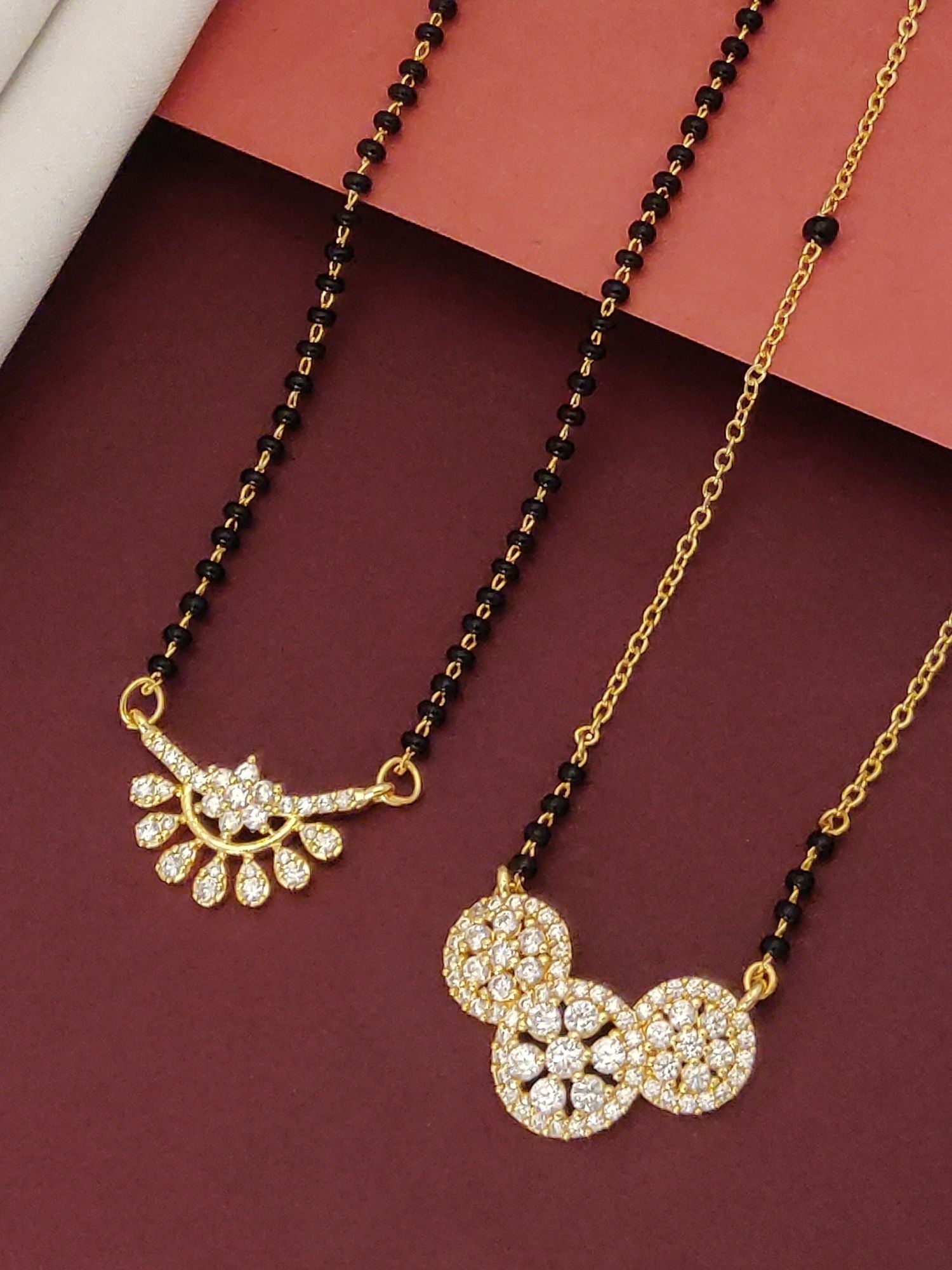 Abdesigns Precise Set of 2 gold plated mangalsutra combo for women. Dual gold mangalsutras with black beads and pave pendants