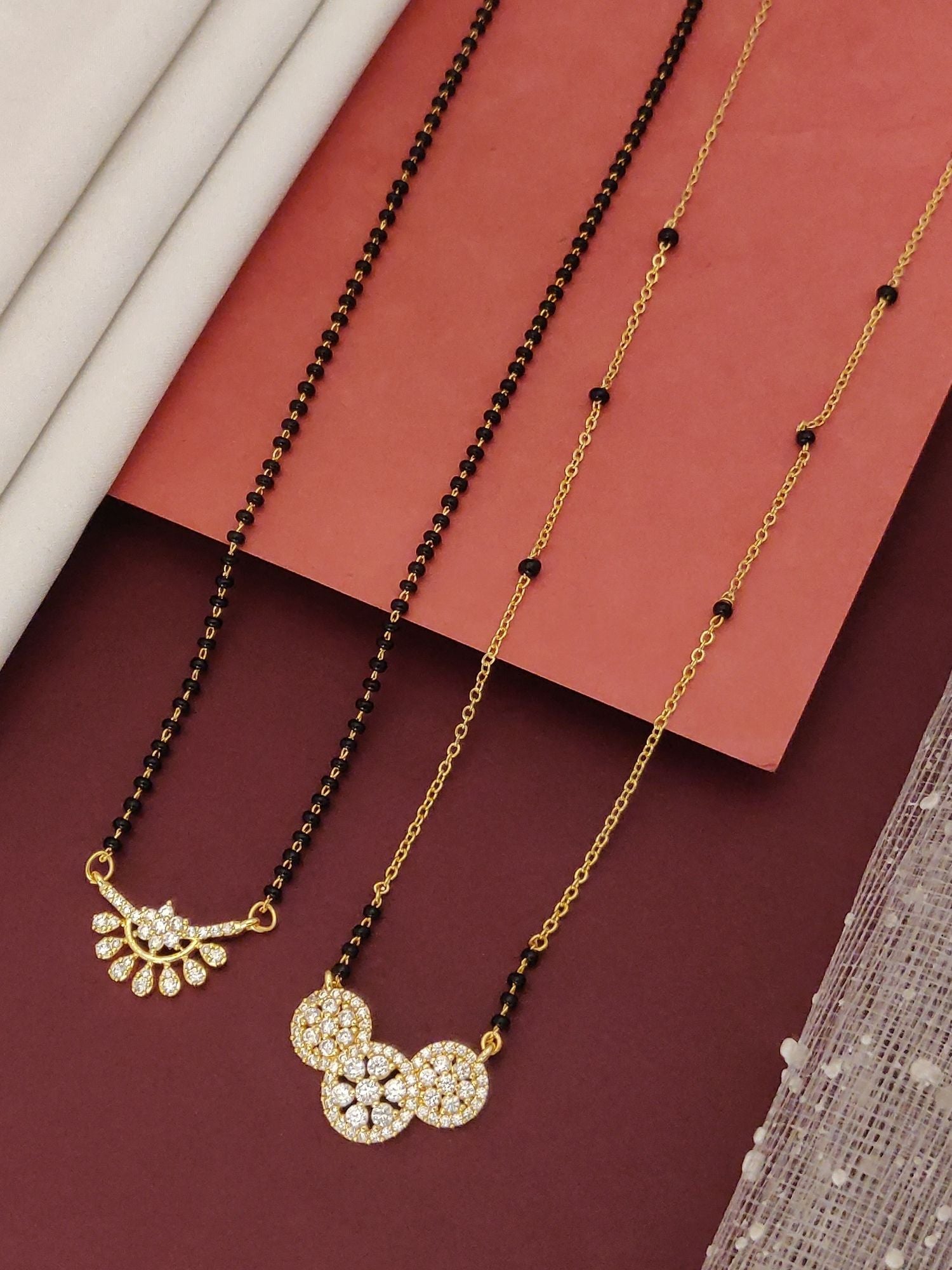 Abdesigns Precise Set of 2 gold plated mangalsutra combo for women. Two gold pendant mangalsutras with black beads