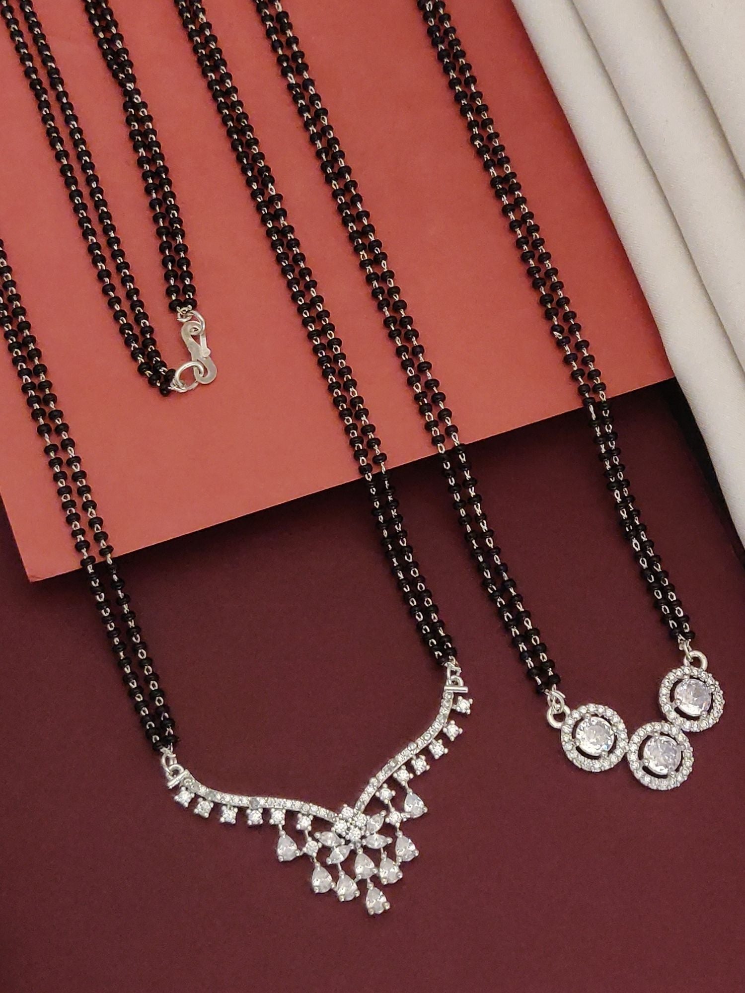 Abdesigns Set of 2 Fashionable silver plated mangalsutra combo for women. Dual black bead chains with cubic zirconia pendants