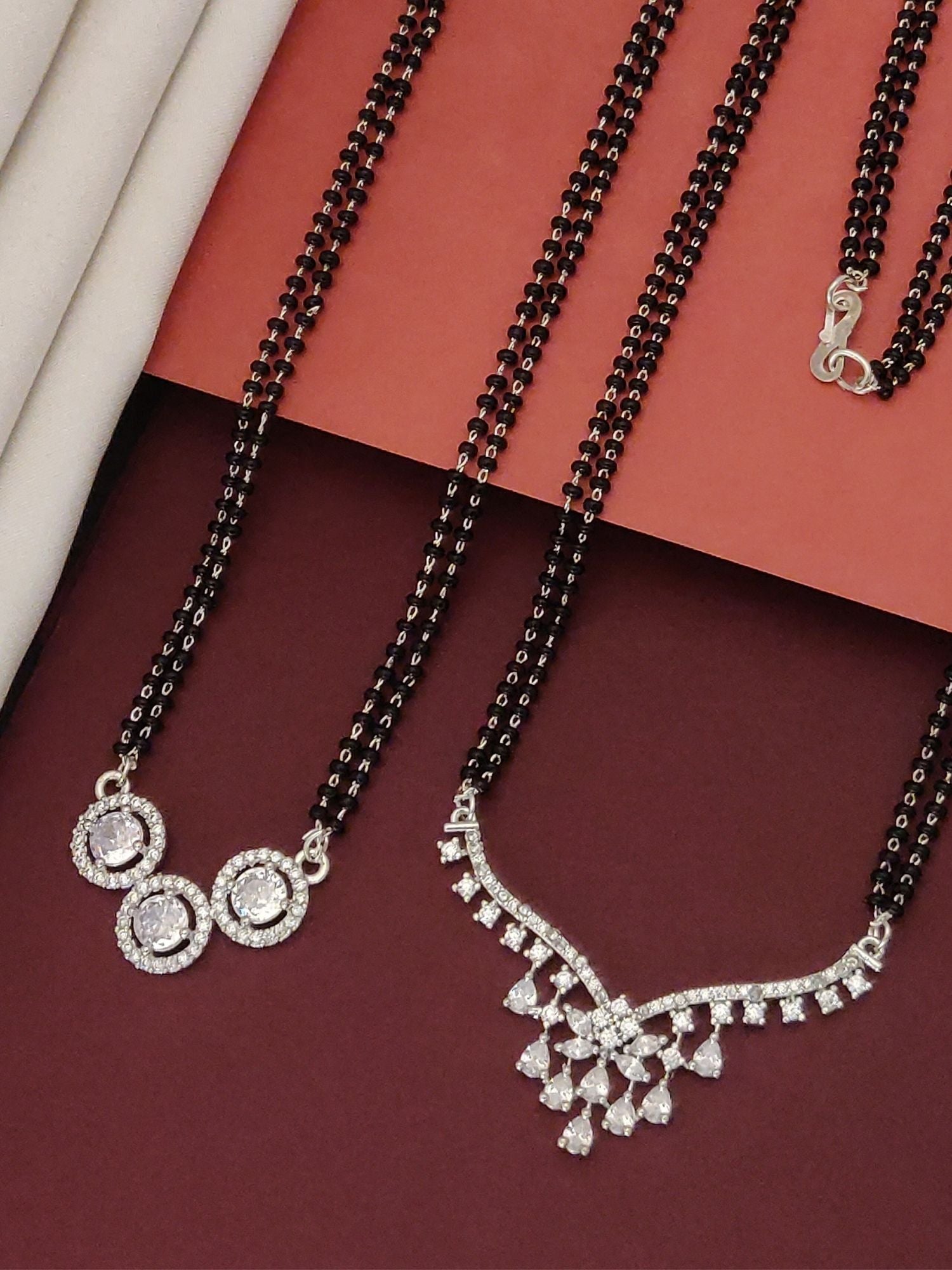 Abdesigns Set of 2 Fashionable silver plated mangalsutra combo for women. Use this keyword in the exact form it is provided.