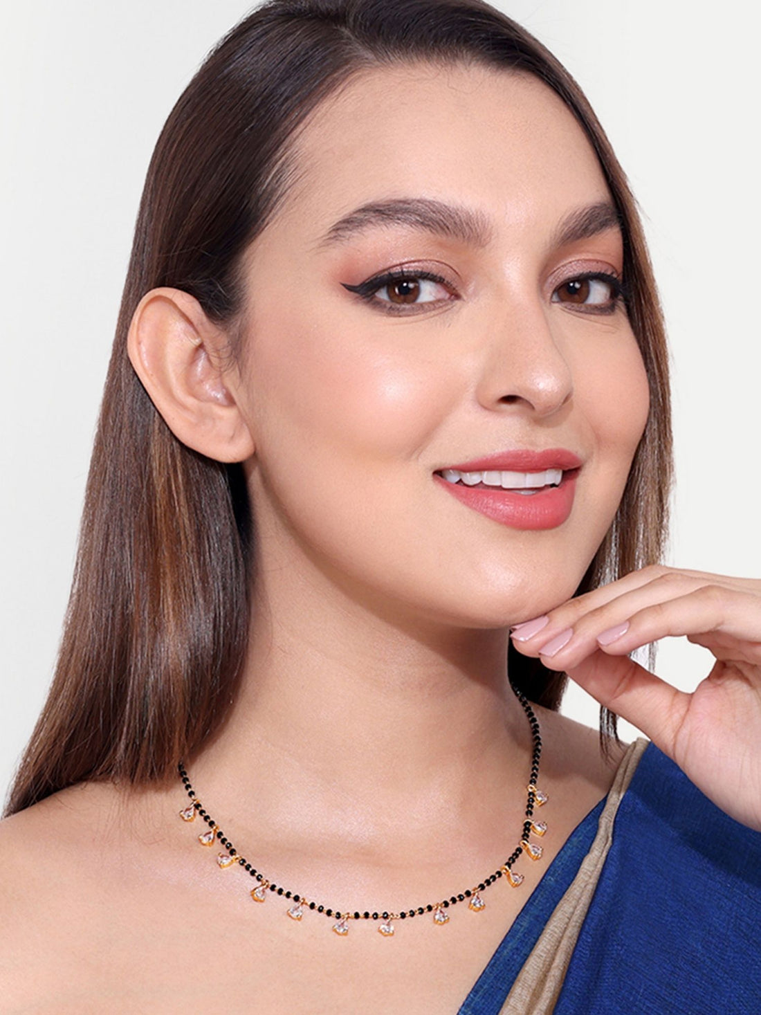 Abdesigns Set of 2 gold plated mangalsutra combo for women. Necklace with black beads and dangling charms on model