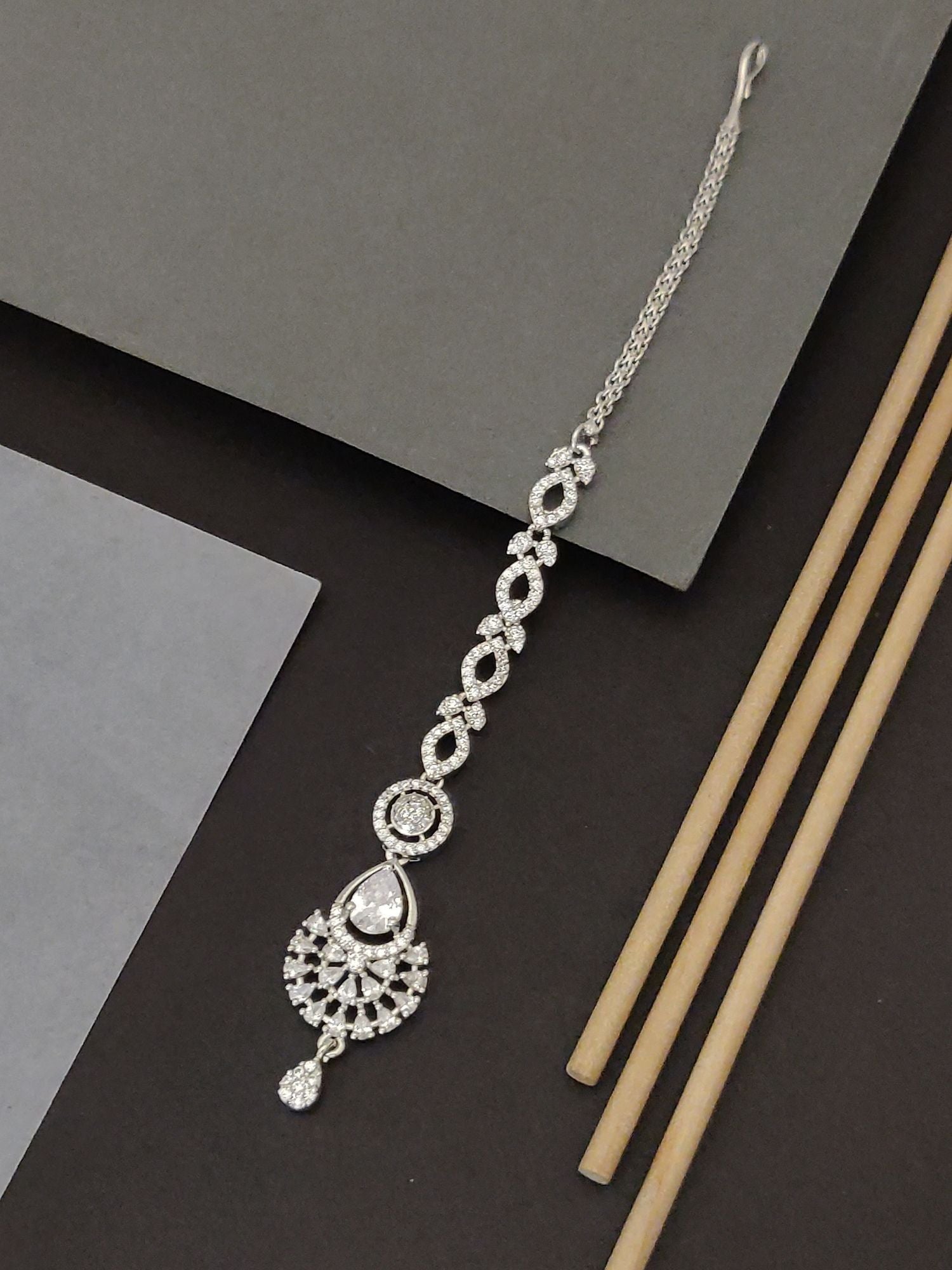 Abdesigns Silver CZ Bridal Maangtikka . Silver cubic zirconia maangtikka with teardrop pendant and chain for bridal wear