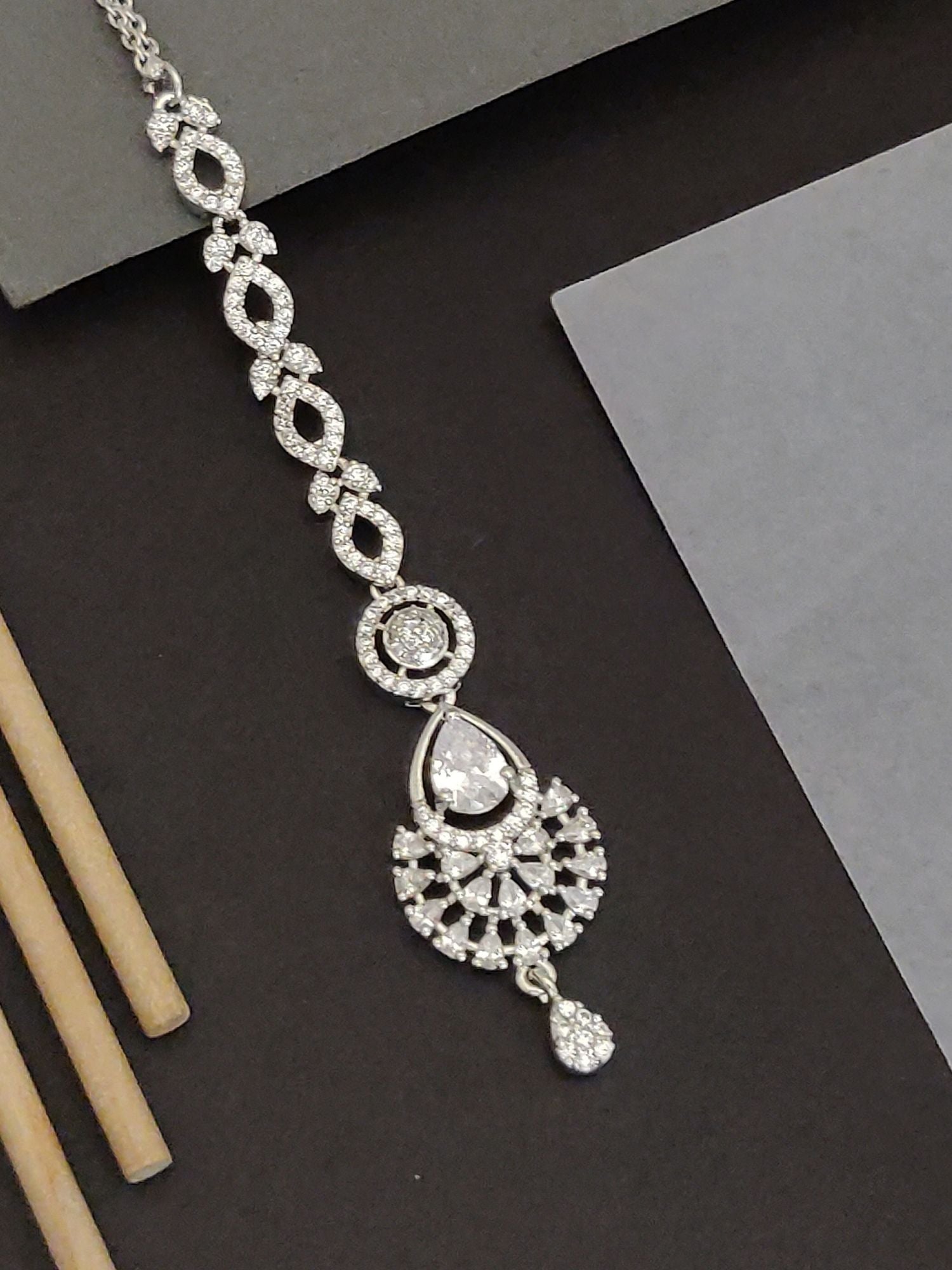 Abdesigns Silver CZ Bridal Maangtikka . Silver cz maangtikka with teardrop pendant and intricate crystal chain for bridal look